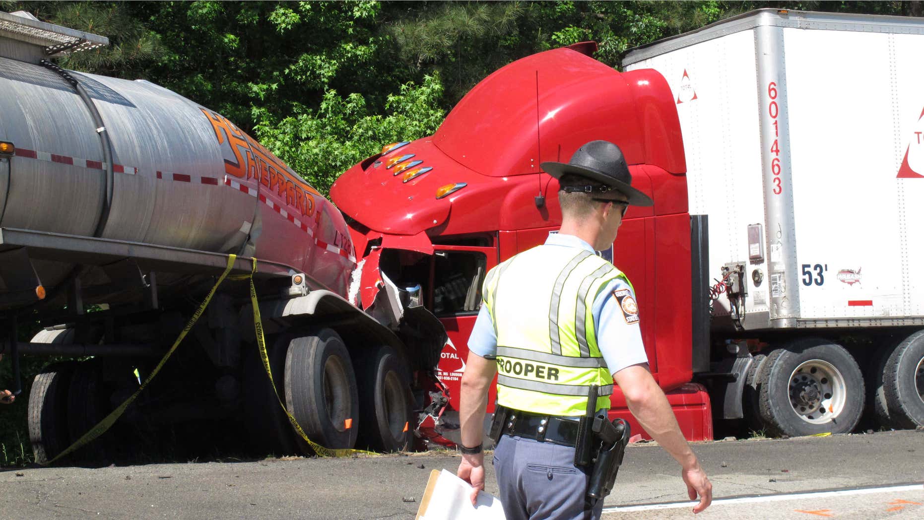 April 22, 2015: A Georgia state trooper works the scene of a deadly crash in which five people died and three others were injured.
