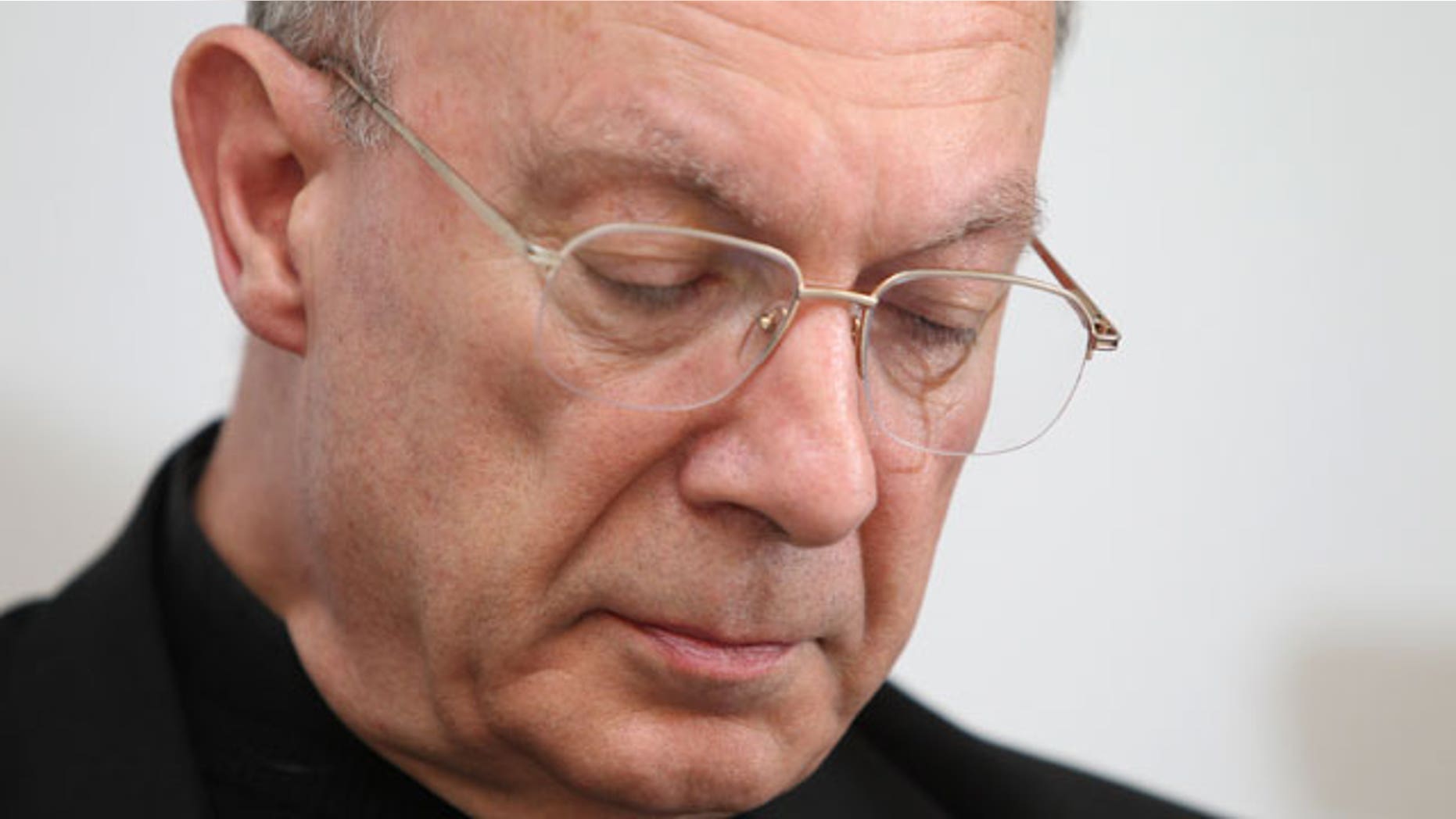 Belgium's Archbishop Andre-Joseph Leonard looks down as he reads a statement announcing the resignation of Belgium's longest serving bishop Roger Vangheluwe, 73, in Brussels, Friday, April 23, 2010 after he admitted to sexually abusing a young boy about 25 years ago. The resignation of Vangheluwe, the Bishop of Bruges, is the the first from Belgium since a child abuse scandal began testing the Catholic Church several months ago in Europe and the United States.