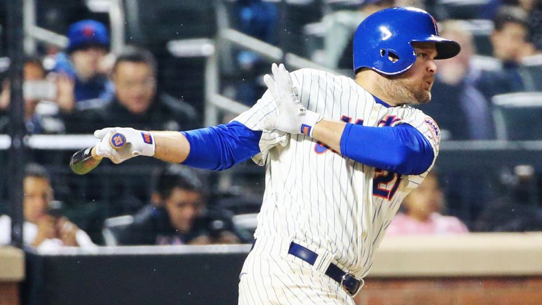 Apr 22, 2014; New York, NY, USA; New York Mets first baseman Lucas Duda (21) singles to center during the fifth inning against the St. Louis Cardinals at Citi Field. Mandatory Credit: Anthony Gruppuso-USA TODAY Sports