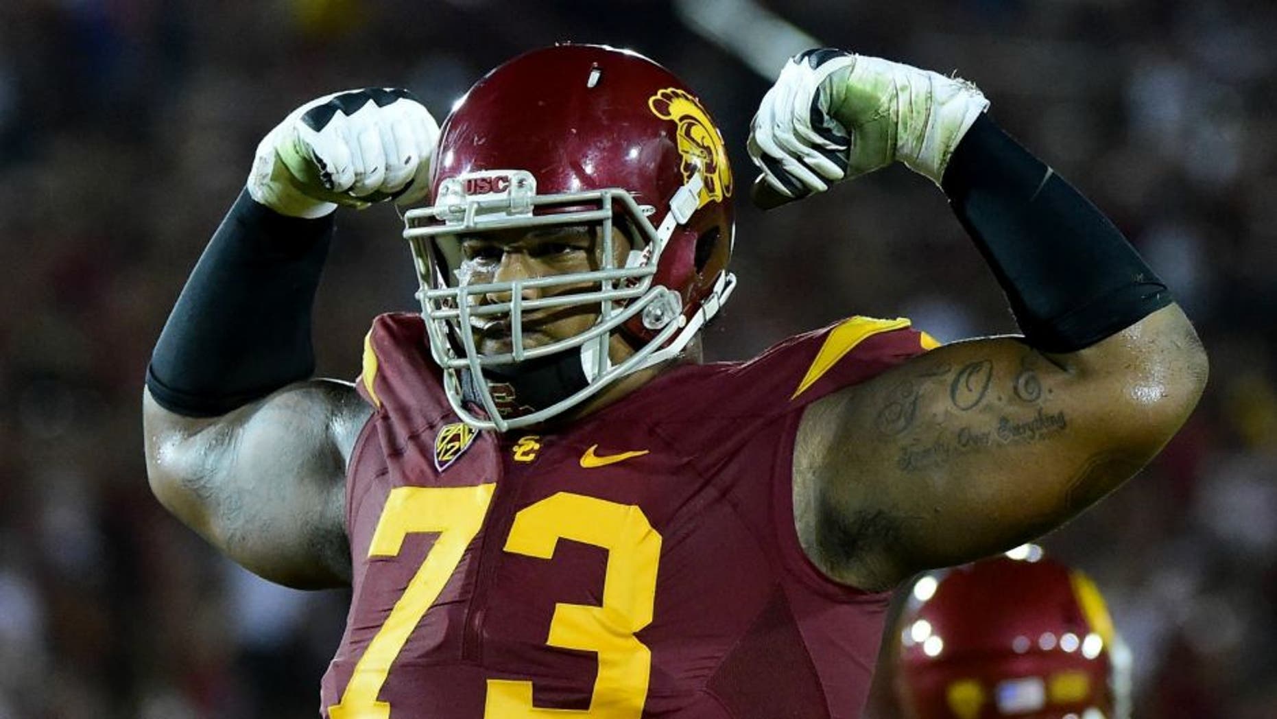 at Los Angeles Memorial Coliseum on October 24, 2015 in Los Angeles, California.,LOS ANGELES, CA - OCTOBER 24: Zach Banner #73 of the USC Trojans celebrates a touchdown to take a 35-17 win over the Utah Utes during the third quarter at Los Angeles Memorial Coliseum on October 24, 2015 in Los Angeles, California. (Photo by Harry How/Getty Images)