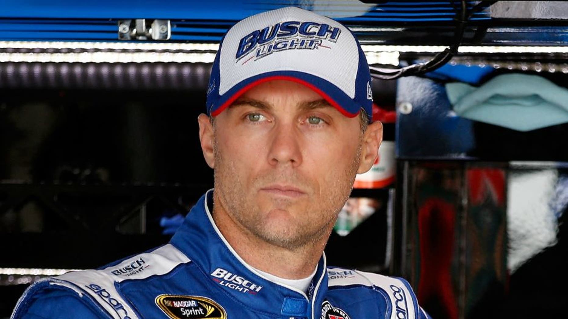 during practice for the NASCAR Sprint Cup Series TOYOTA OWNERS 400 at Richmond International Raceway on April 22, 2016 in Richmond, Virginia.,RICHMOND, VA - APRIL 22: Kevin Harvick, driver of the #4 Busch Light Chevrolet, stands in the garage area during practice for the NASCAR Sprint Cup Series TOYOTA OWNERS 400 at Richmond International Raceway on April 22, 2016 in Richmond, Virginia. (Photo by Todd Warshaw/Getty Images)