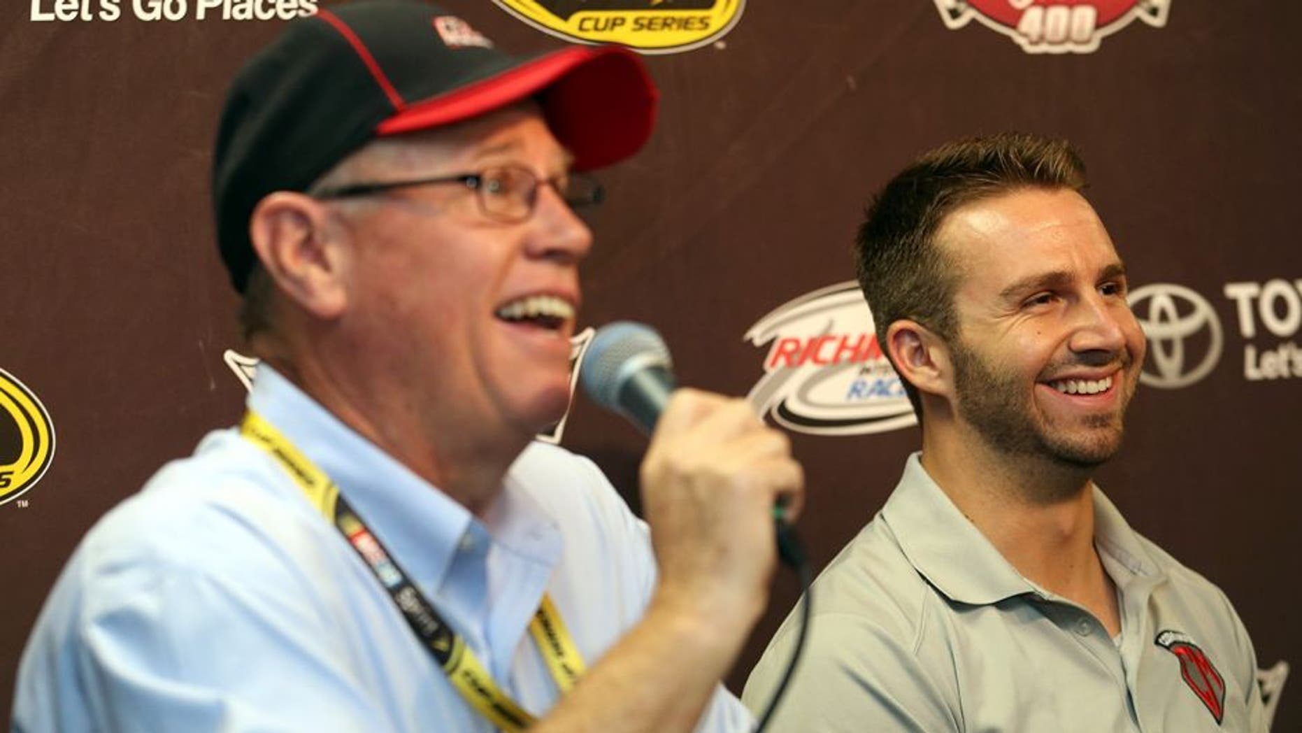 RICHMOND, VA - APRIL 22: Matt DiBenedetto, driver of the #83 E.J. Wade Construction Toyota, and BK Racing owner Ron Devine speak with media before a practice for the NASCAR Sprint Cup Series TOYOTA OWNERS 400 at Richmond International Raceway on April 22, 2016 in Richmond, Virginia. (Photo by Matt Hazlett/Getty Images)