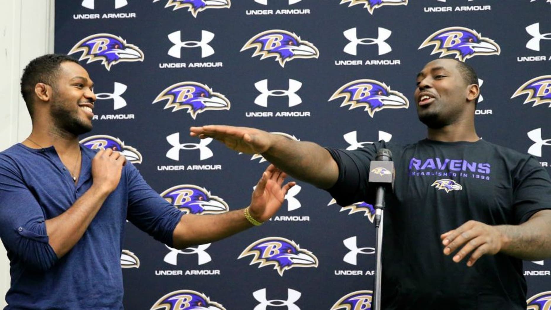 on November 13, 2013 in Owings Mills, Maryland.,OWINGS MILLS, MD - NOVEMBER 13: UFC fighter Jon Jones (L) jokes around with his brother defensive end Arthur Jones #97 of the Baltimore Ravens during a news conference at the teams training facility November 13, 2013 in Owings Mills, Maryland. (Photo by Rob Carr/Getty Images)