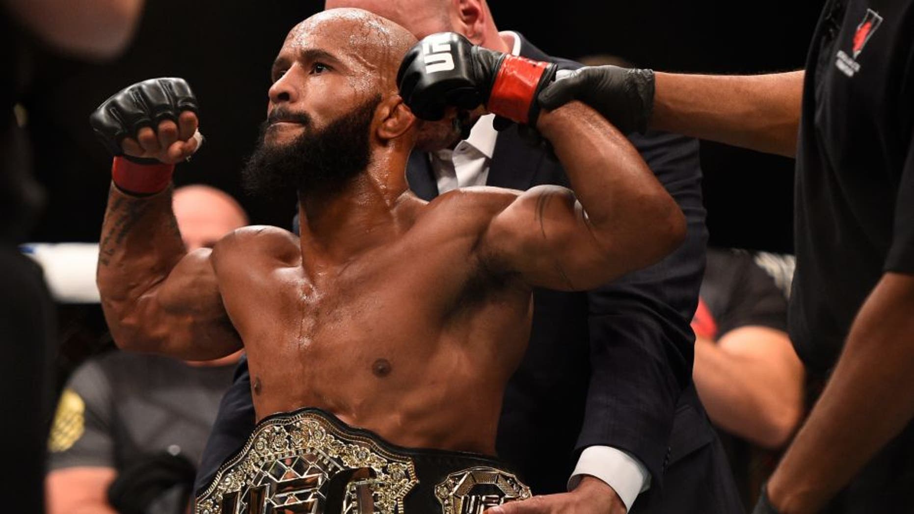 LAS VEGAS, NV - SEPTEMBER 05: Demetrious Johnson reacts after his victory over John Dodson in their flyweight championship bout during the UFC 191 event inside MGM Grand Garden Arena on September 5, 2015 in Las Vegas, Nevada. (Photo by Jeff Bottari/Zuffa LLC/Zuffa LLC via Getty Images)