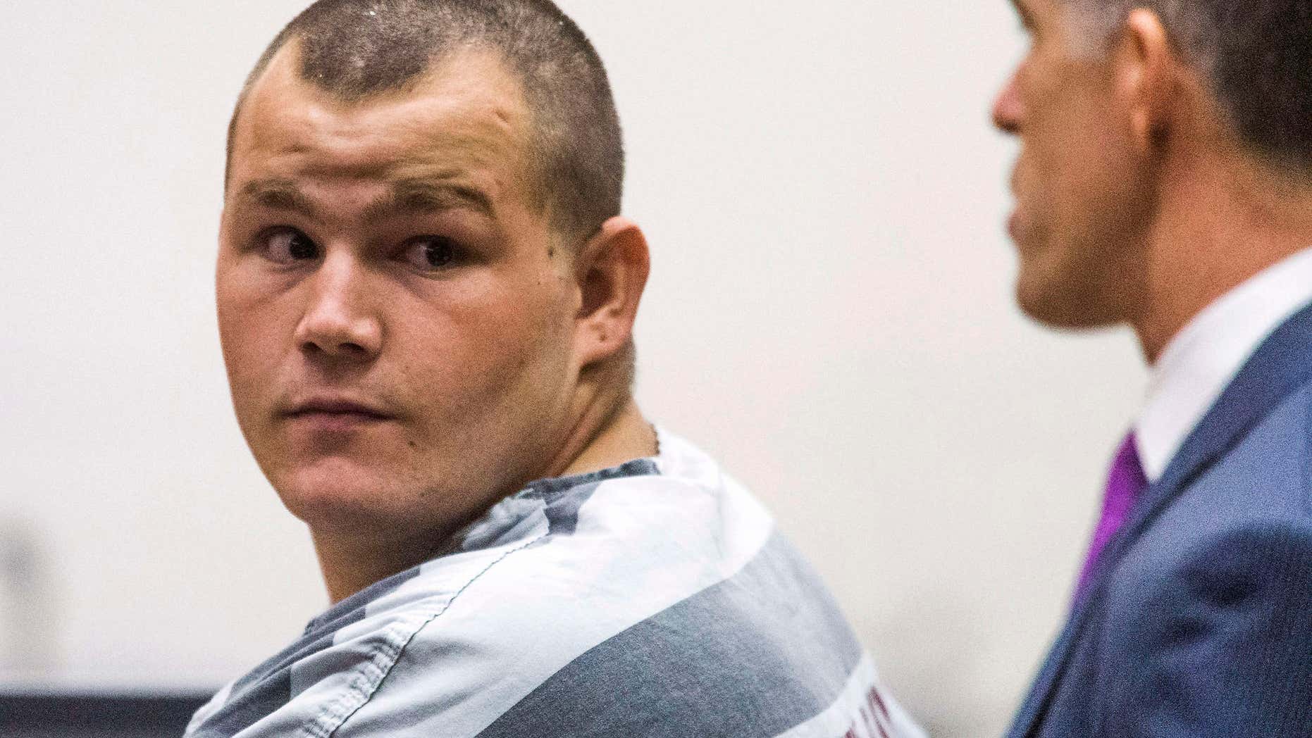FILE - In this Oct. 1, 2015 file photo, accused freeway shooter Leslie Allen Merritt, Jr., appears in Maricopa County Superior Court for his arraignment in Phoenix.