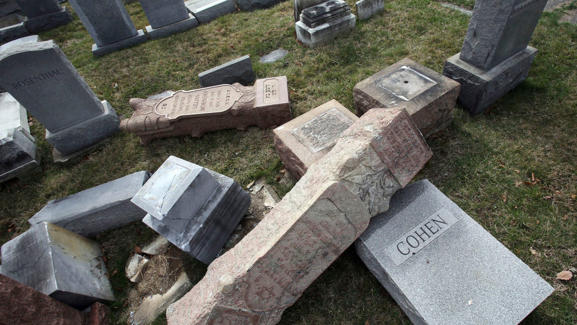 Monday, Feb. 27, 2017: Toppled and damaged headstones rest on the ground at Mount Carmel Cemetery in Philadelphia. The Anti-Defamation League found an increase in cases of anti-Semitic intimidation and vandalism in 2016, evidence that anti-Jewish bias intensified during the election.