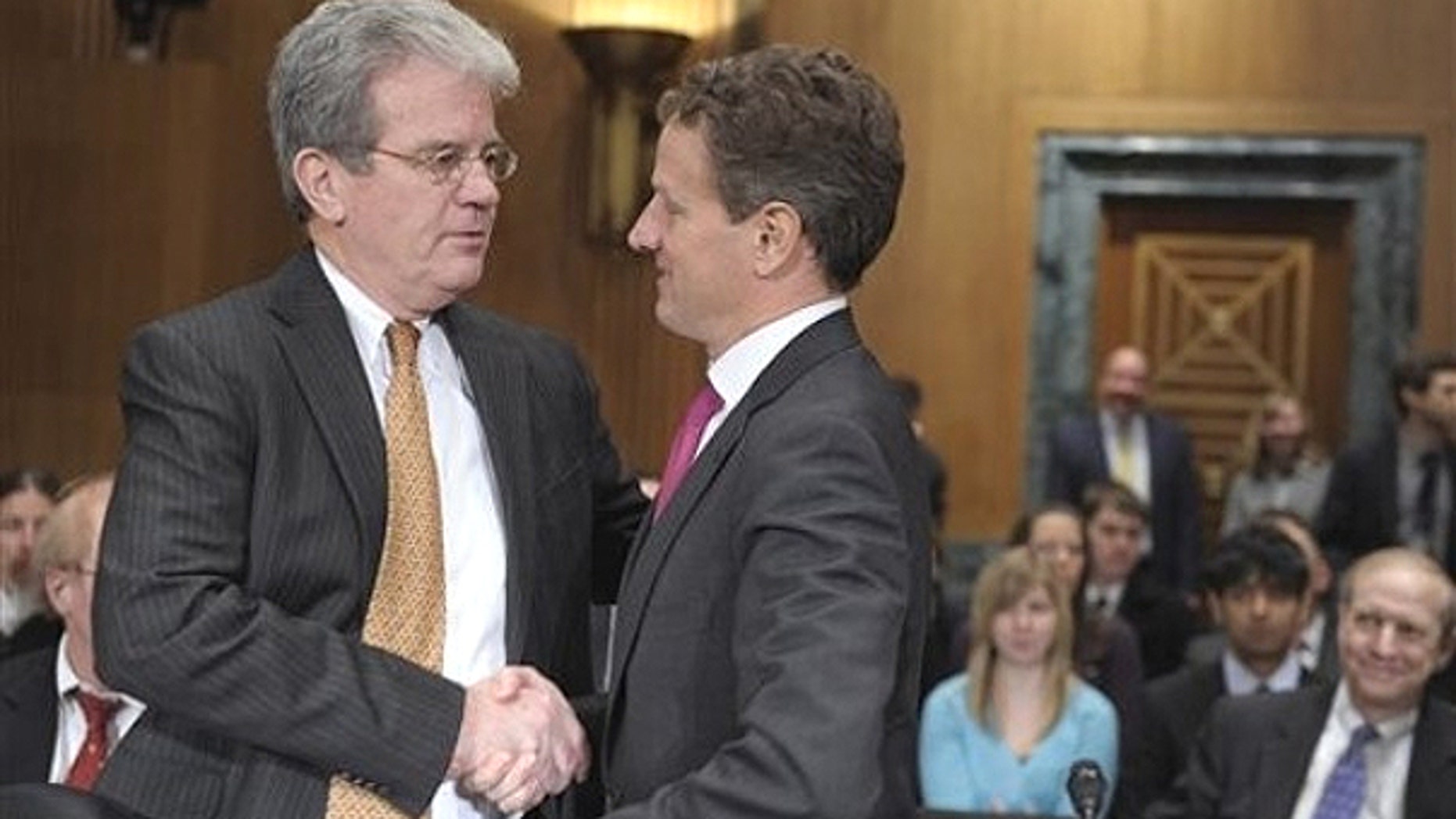 Feb. 16: Senate Finance Committee member Sen. Tom Coburn, R-Okla. , left., talks with Treasury Secretary Timothy Geithner on Capitol Hill in Washington.