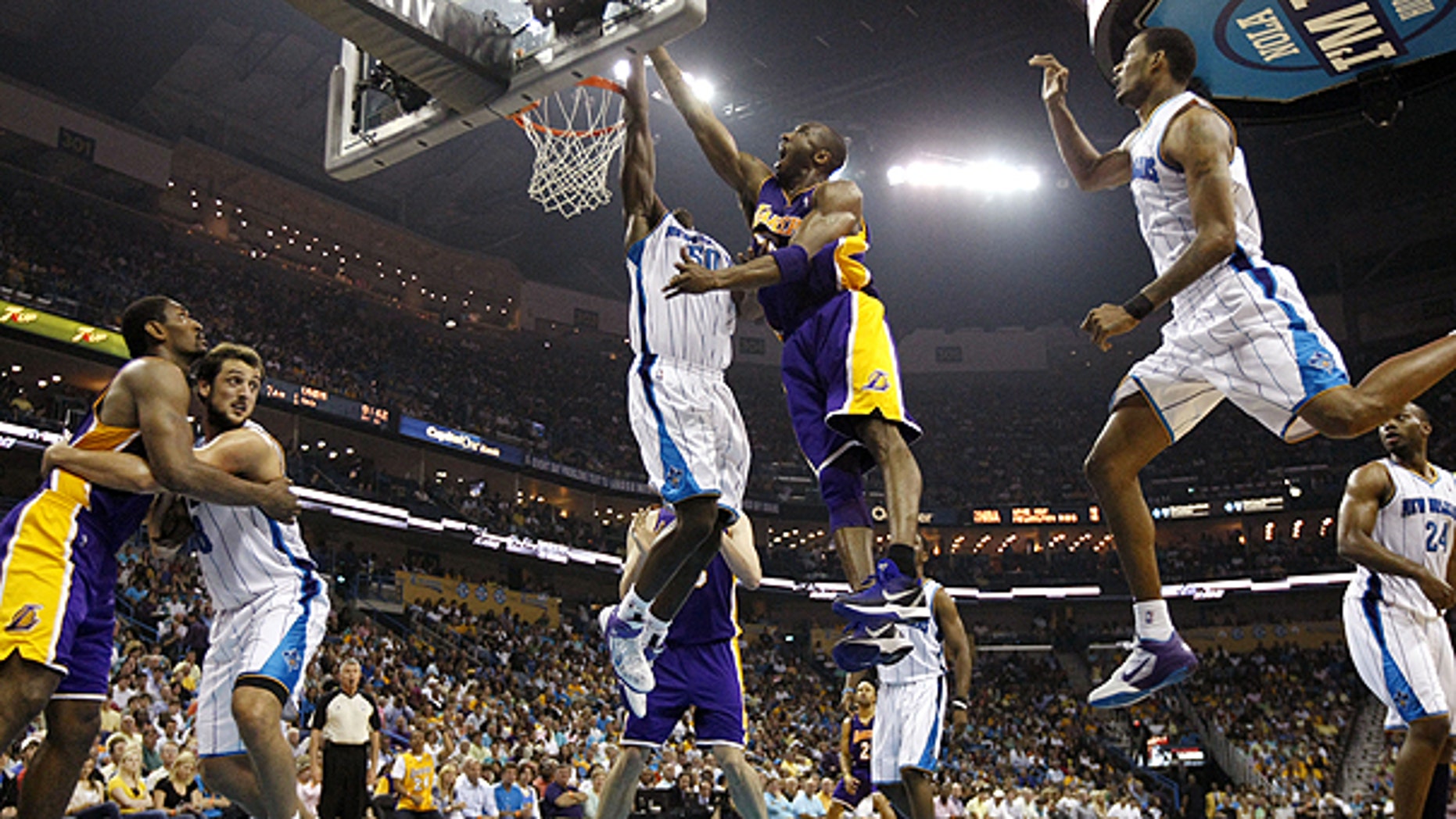 April 24: New Orleans Hornets center Emeka Okafor (50) blocks a shot by Los Angeles Lakers guard Kobe Bryant (24), center, during the second quarter of game four of a first-round NBA basketball playoff series in New Orleans.