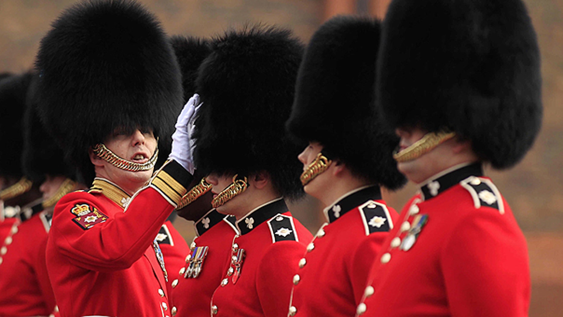 April 21: A Company Sergeant Major of the 1st Battalion Irish Guards inspects guardsmen's bearskins, as they take part in an inspection ahead of the royal wedding at their barracks in Windsor, England.