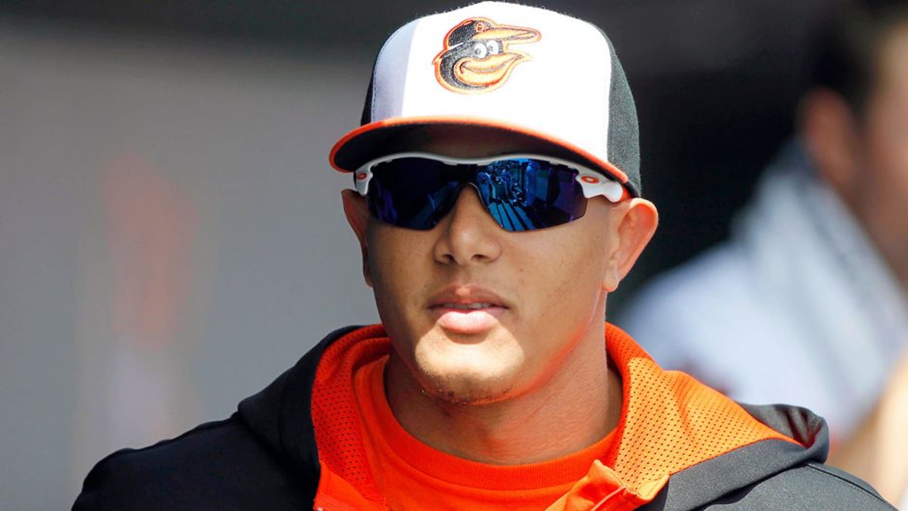 Mar 15, 2014; Sarasota, FL, USA; Baltimore Orioles third baseman Manny Machado (13) in the dugout against the New York Yankees at Ed Smith Stadium. Mandatory Credit: Kim Klement-USA TODAY Sports
