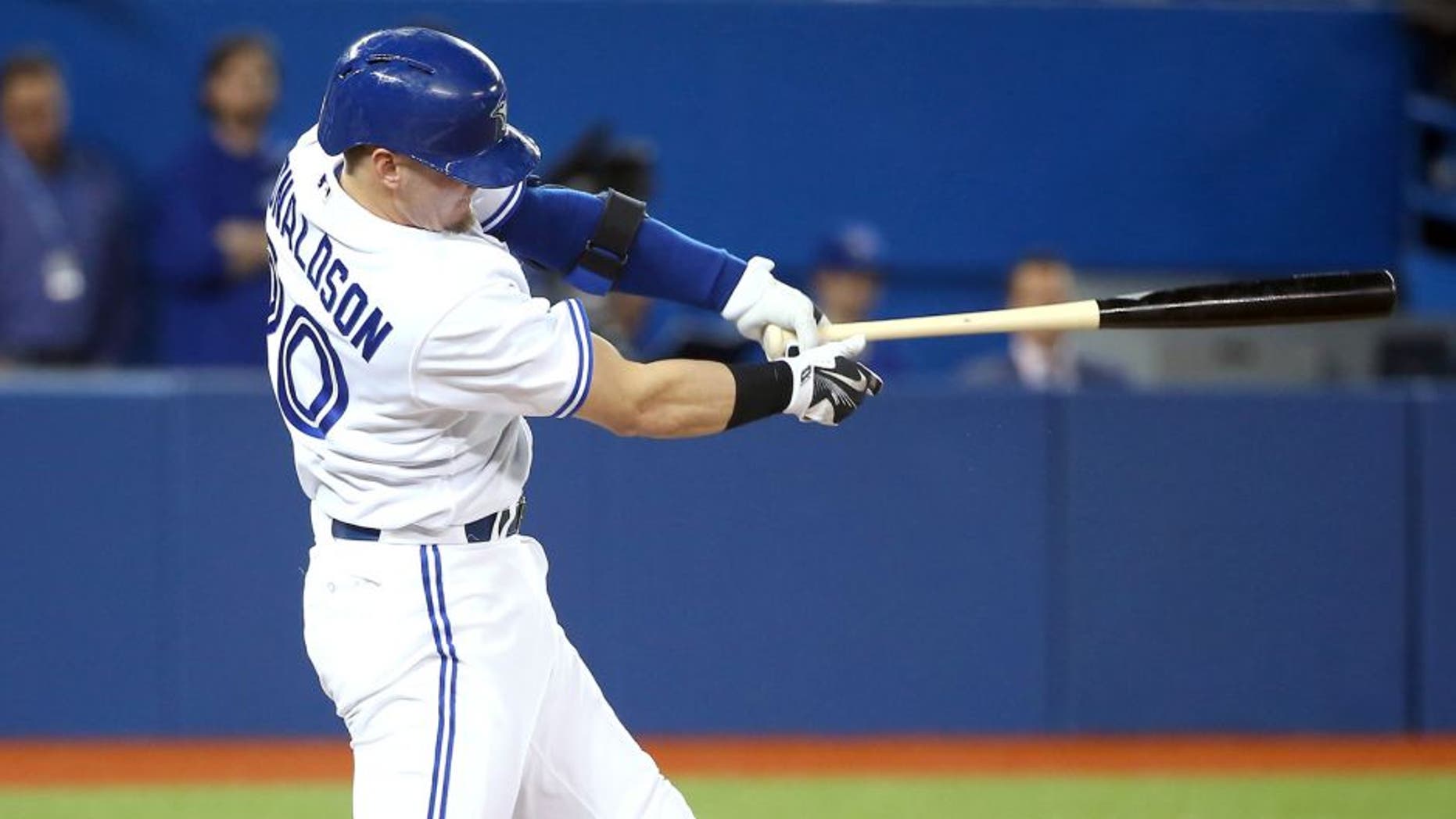 TORONTO, CANADA - APRIL 23: Josh Donaldson #36 of the Toronto Blue Jays hits a two-run home run in the third inning during MLB game action against the Baltimore Orioles on April 23, 2015 at Rogers Centre in Toronto, Ontario, Canada. (Photo by Tom Szczerbowski/Getty Images)