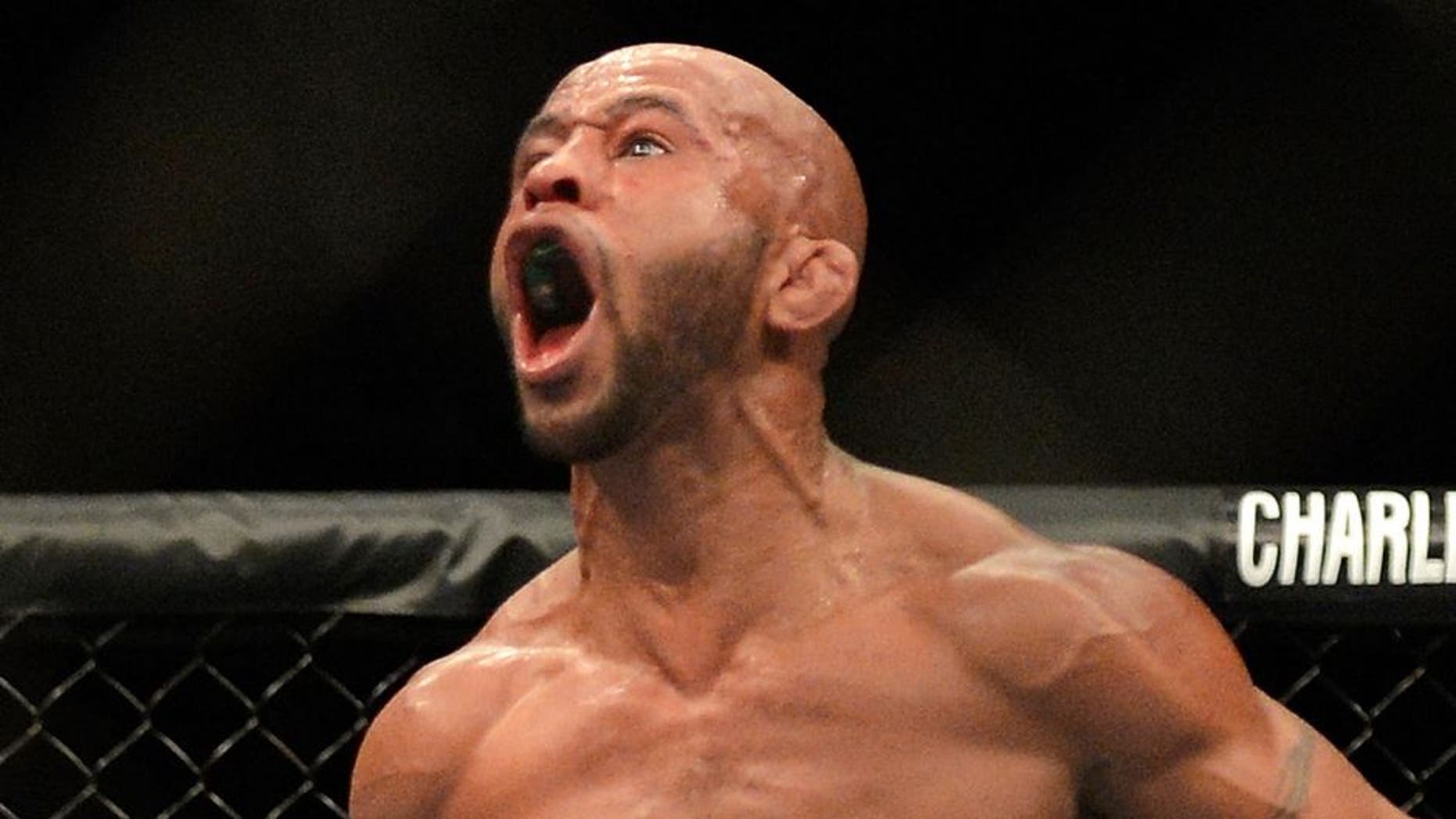 SEATTLE, WA - JULY 27: Demetrious Johnson celebrates his victory over John Moraga in their flyweight championship bout during the UFC on FOX event at Key Arena on July 27, 2013 in Seattle, Washington. (Photo by Jeff Bottari/Zuffa LLC/Zuffa LLC via Getty Images)