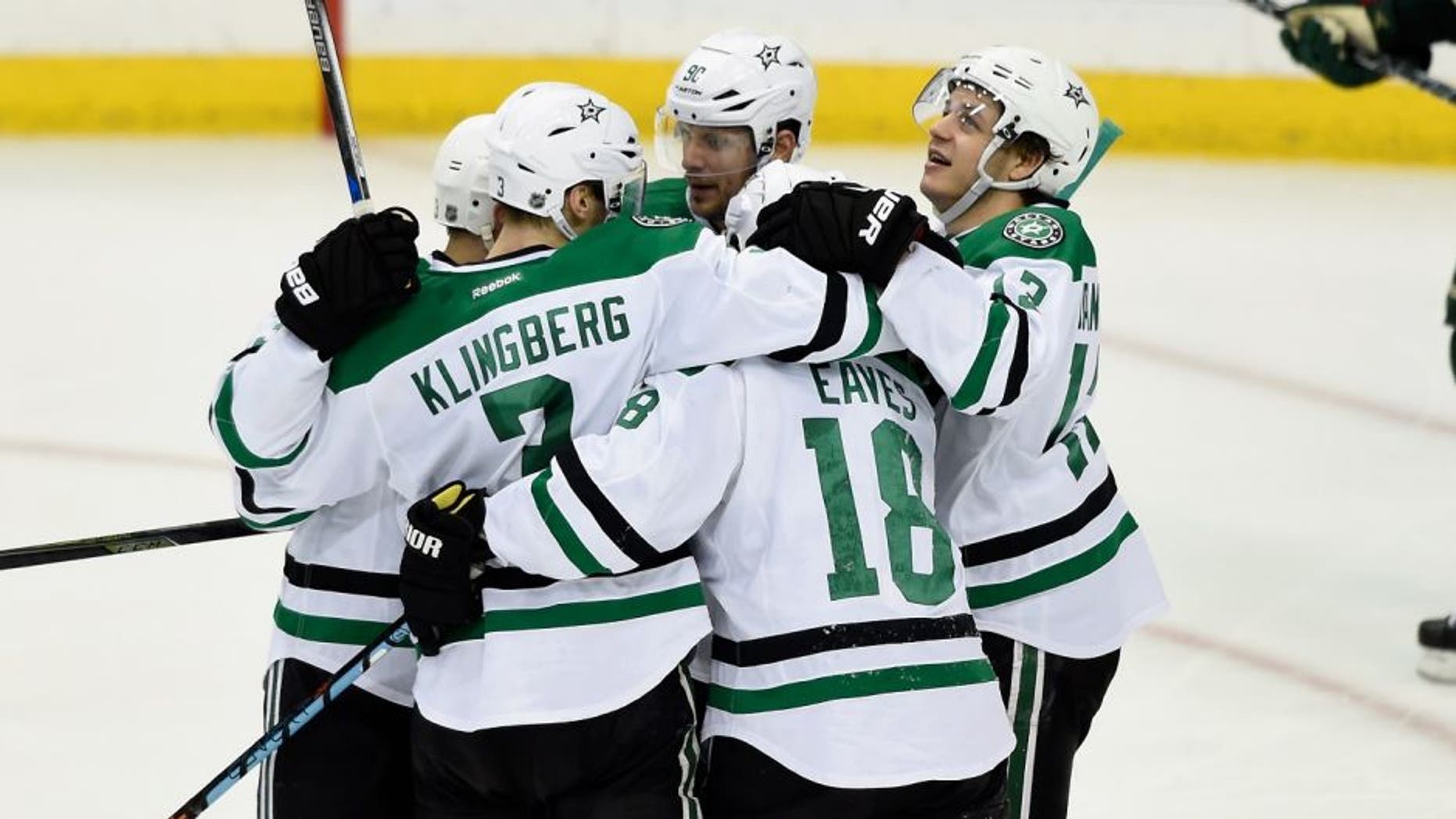 ST PAUL, MN - APRIL 24: Jared Spurgeon #46 of the Minnesota Wild looks on as the Dallas Stars celebrate a goal by Alex Goligoski #33 during the third period of Game Six of the Western Conference First Round during the 2016 NHL Stanley Cup Playoffs on April 24, 2016 at Xcel Energy Center in St Paul, Minnesota. The Stars defeated the Wild 5-4. (Photo by Hannah Foslien/Getty Images)