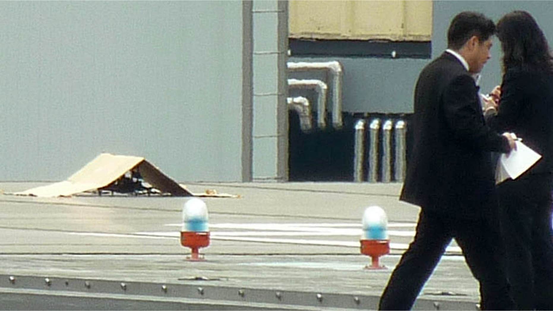 April 22, 2015: A small drone covered with cardboard, is seen on the roof of Prime Minister Shinzo Abe's official residence in Tokyo.
