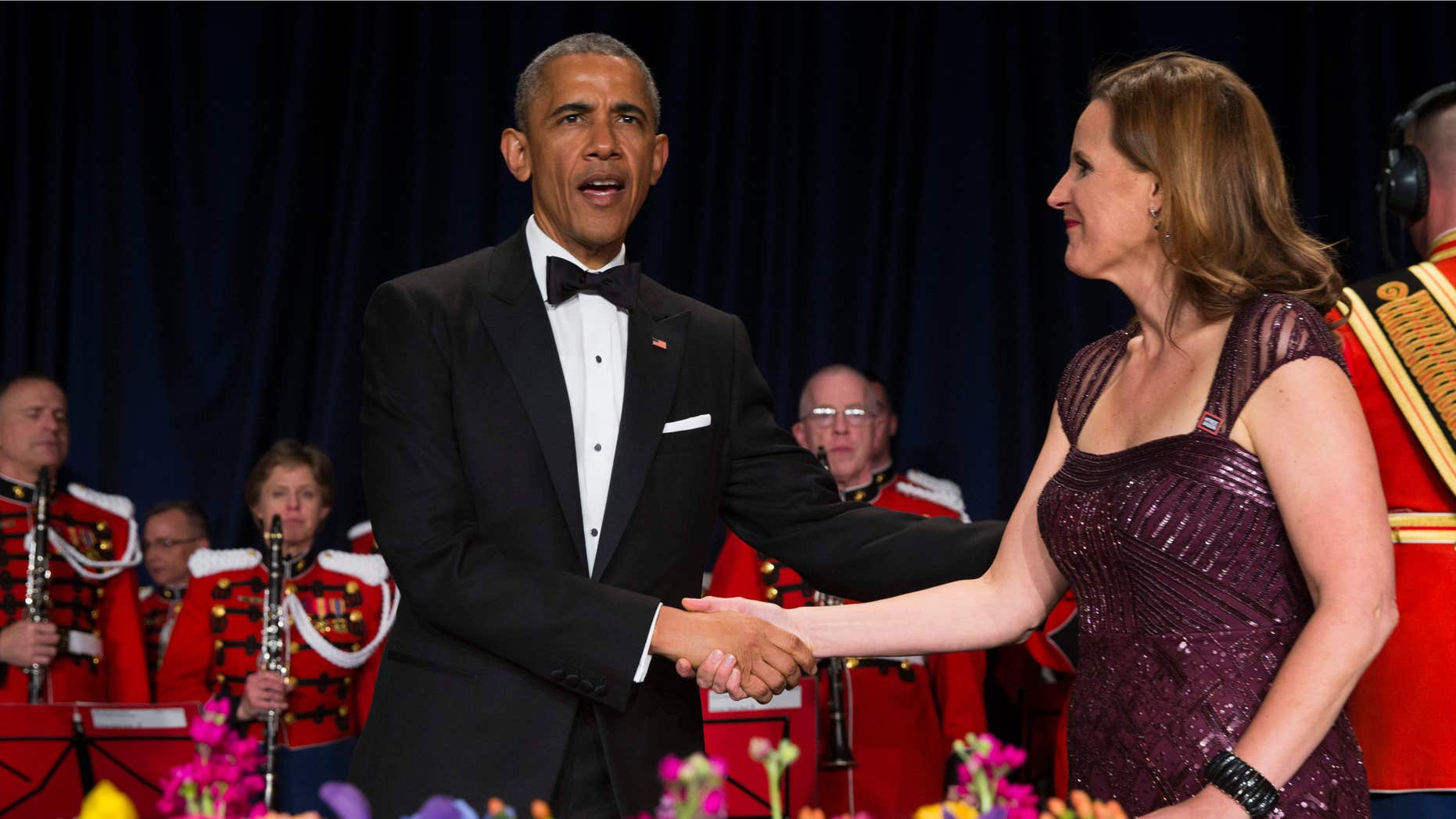 April 25, 2015: President Barack Obama, left, is greeted by White House Correspondents Association president Christi Parsons during the White House Correspondents' Association dinner at the Washington Hilton