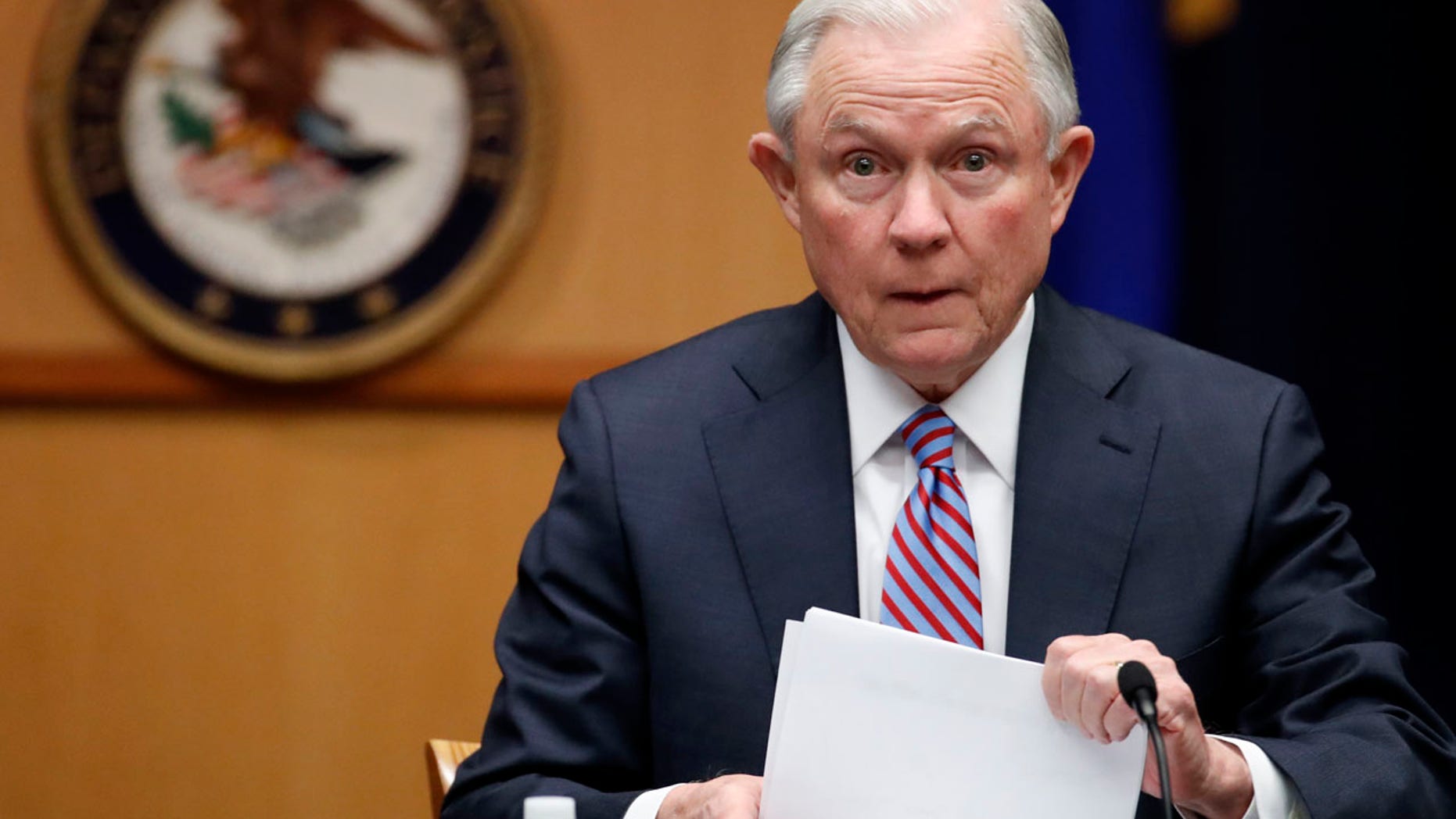 In this April 18, 2017 file photo Attorney General Jeff Sessions prepares to speak before a meeting of the Attorney General's Organized Crime Council and Organized Crime Drug Enforcement Task Forces (OCDETF) Executive Committee to discuss implementation of the President's Executive Order 13773, at the Department of Justice in Washington.