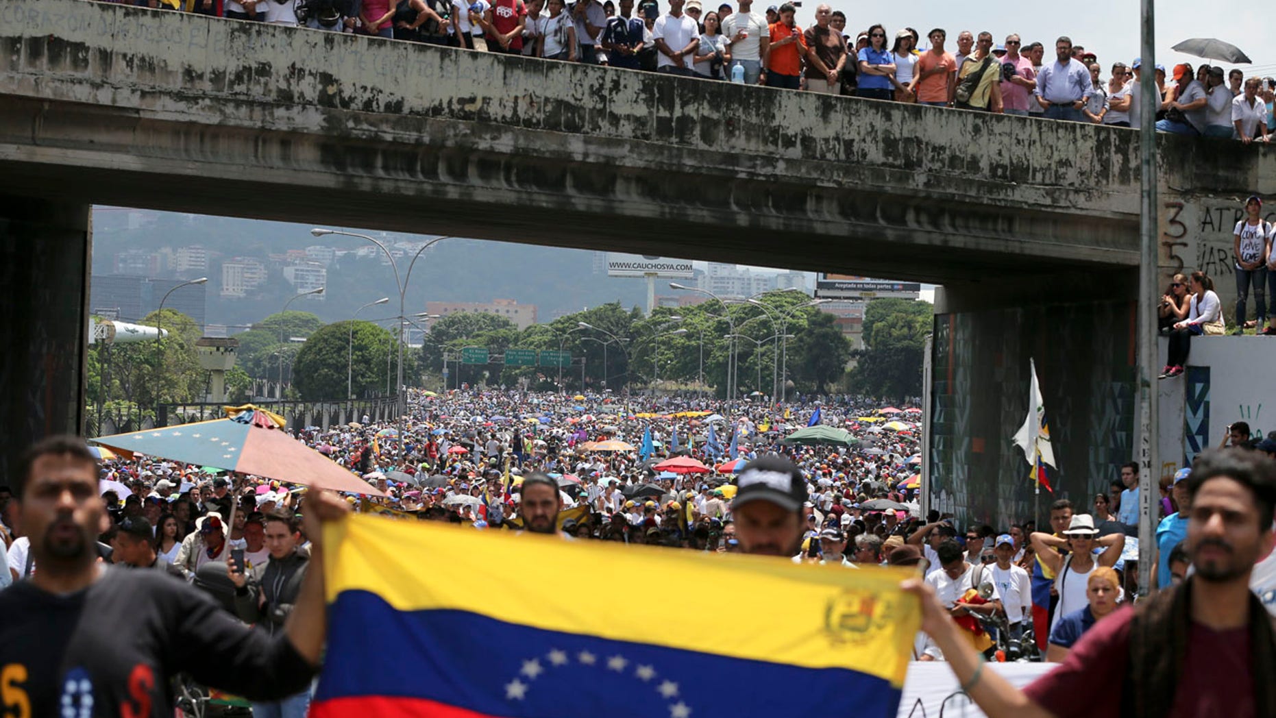 Anti-government protesters block a highway in Caracas, Venezuela, Monday, April 24, 2017.