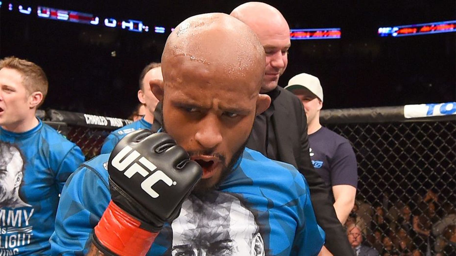MONTREAL, QC - APRIL 25: Demetrious Johnson of the United States reacts after his submission victory over Kyoji Horiguchi of Japan in their UFC flyweight championship bout during the UFC 186 event at the Bell Centre on April 25, 2015 in Montreal, Quebec, Canada. (Photo by Josh Hedges/Zuffa LLC/Zuffa LLC via Getty Images)