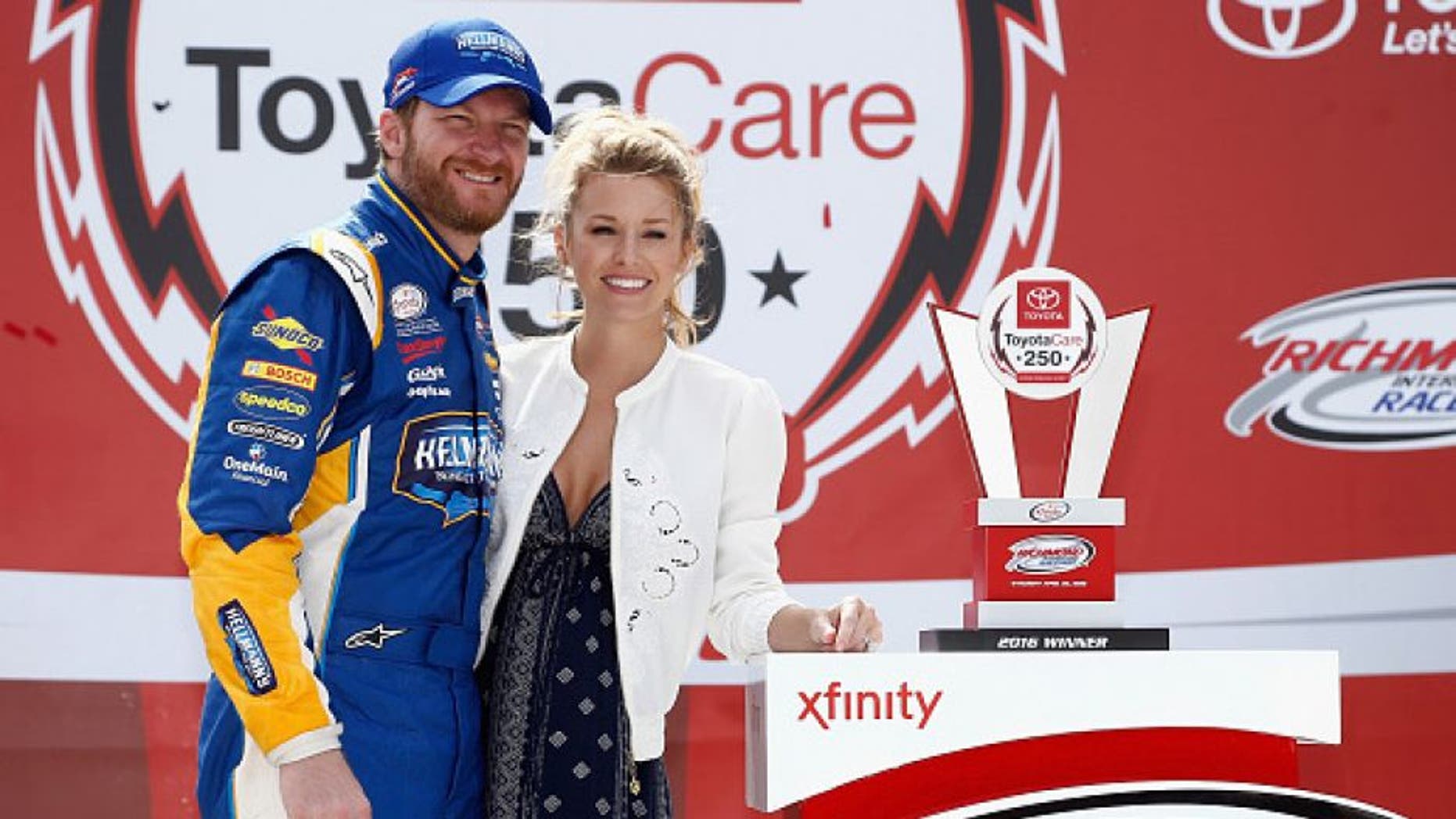 RICHMOND, VA - APRIL 23: Dale Earnhardt Jr., driver of the #88 Hellmann's Chevrolet, poses for a photo with his girlfriend Amy Reimann in Victory Lane after winning the NASCAR XFINITY Series ToyotaCare 250 at Richmond International Raceway on April 23, 2016 in Richmond, Virginia. (Photo by Jeff Zelevansky/Getty Images)