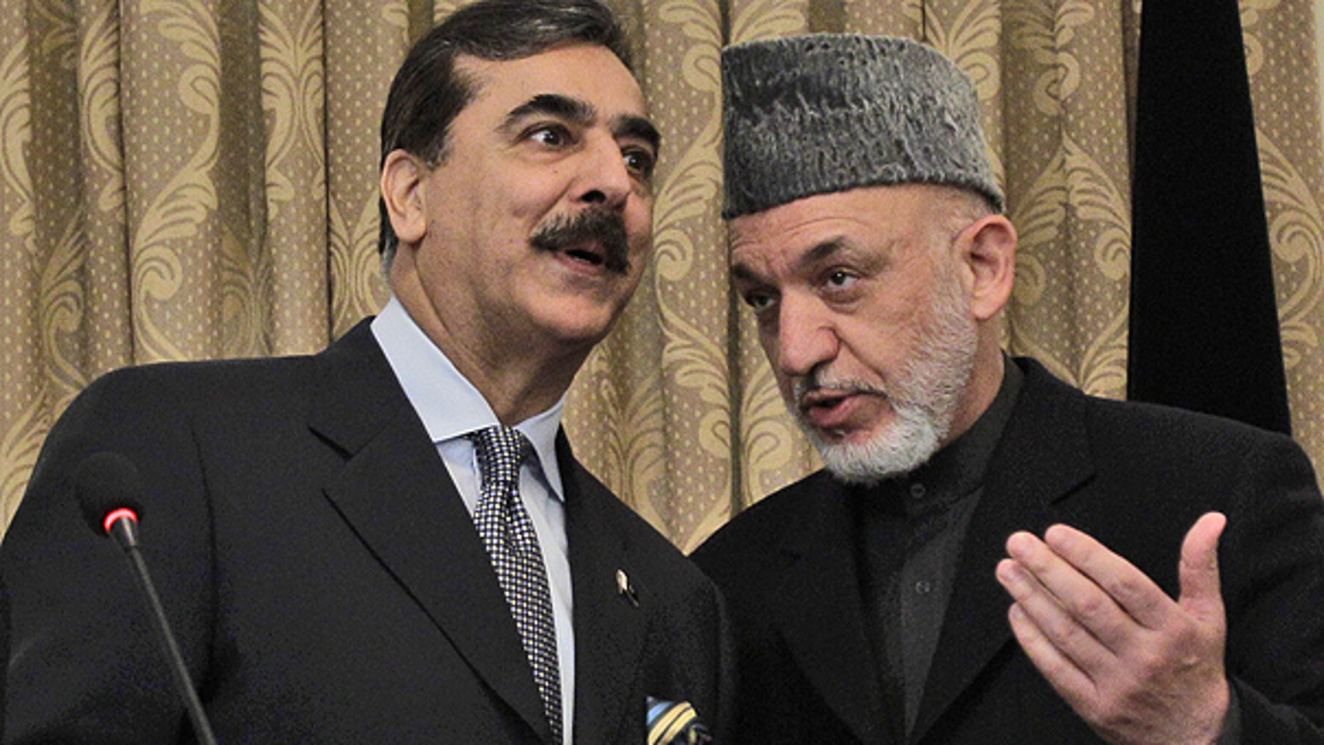 April 16: Pakistan's Prime Minister Raza Gilani, left, speaks with Afghanistan's President Hamid Karzai during a news conference in Kabul, Afghanistan.
