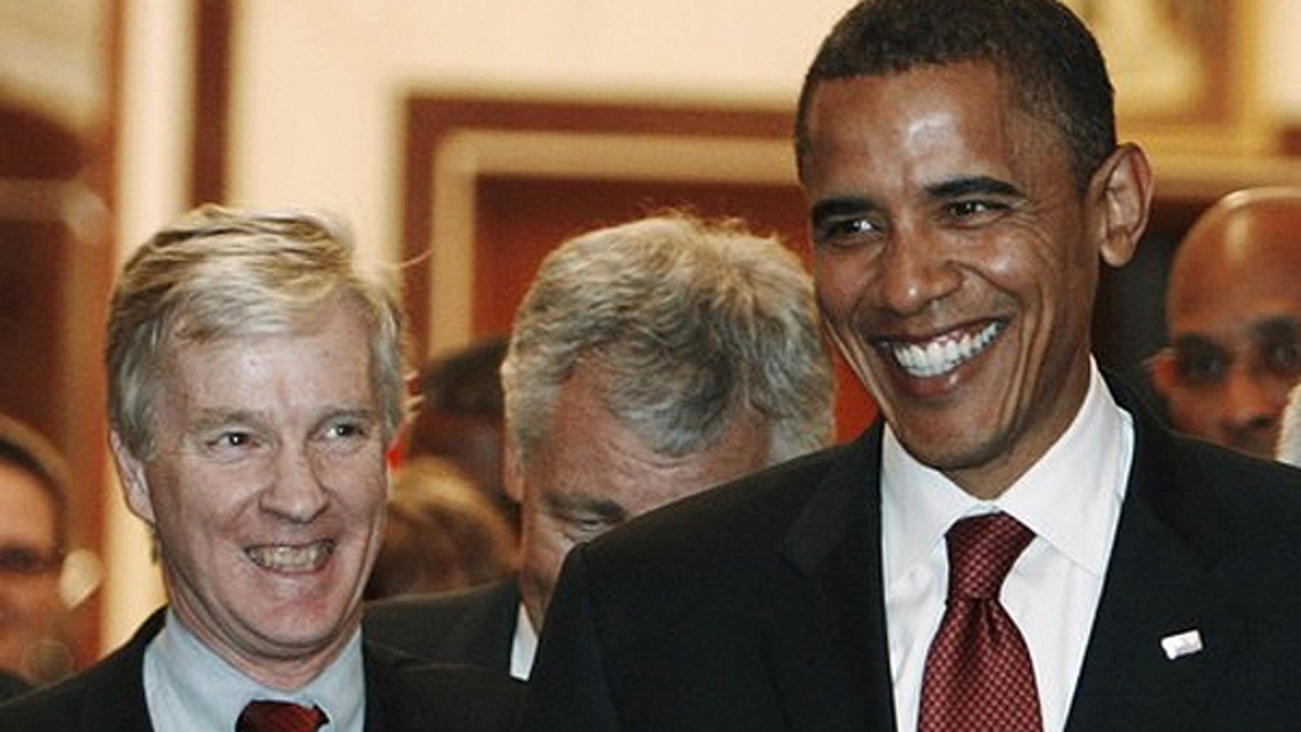 U.S. Democratic presidential candidate Barack Obama (R) and U.S. ambassador to Iraq Ryan Crocker smile as they walk out from the office of Iraqi Prime Minister Nuri al-Maliki after a meeting in Baghdad in this July 21, 2008 file photo.