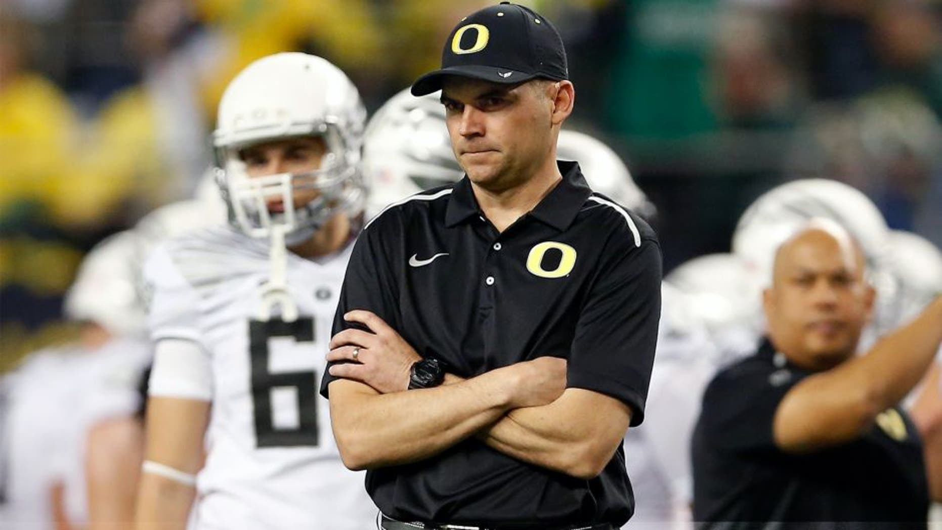 ARLINGTON, TX - JANUARY 12: Head coach Mark Helfrich of the Oregon Ducks looks on against the Ohio State Buckeyes during the College Football Playoff National Championship Game at AT&T Stadium on January 12, 2015 in Arlington, Texas. (Photo by Christian Petersen/Getty Images)