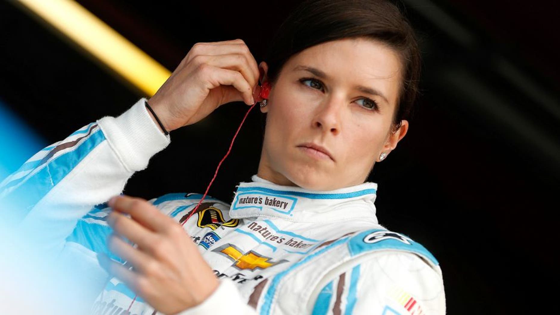 RICHMOND, VA - APRIL 22: Danica Patrick, driver of the #10 Nature's Bakery Chevrolet, stands in the garage area during practice for the NASCAR Sprint Cup Series TOYOTA OWNERS 400 at Richmond International Raceway on April 22, 2016 in Richmond, Virginia. (Photo by Brian Lawdermilk/Getty Images)