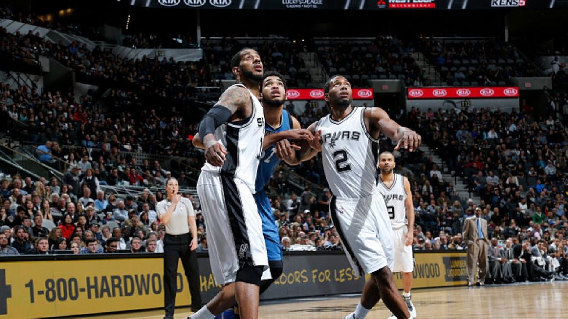 SAN ANTONIO, TX - DECEMBER 28: LaMarcus Aldridge #12 of the San Antonio Spurs and Kawhi Leonard #2 of the San Antonio Spurs box out against Karl-Anthony Towns #32 of the Minnesota Timberwolves on December 28, 2015 at the AT&T Center in San Antonio, Texas. NOTE TO USER: User expressly acknowledges and agrees that, by downloading and or using this photograph, user is consenting to the terms and conditions of the Getty Images License Agreement. Mandatory Copyright Notice: Copyright 2015 NBAE (Photos by Chris Covatta/NBAE via Getty Images)