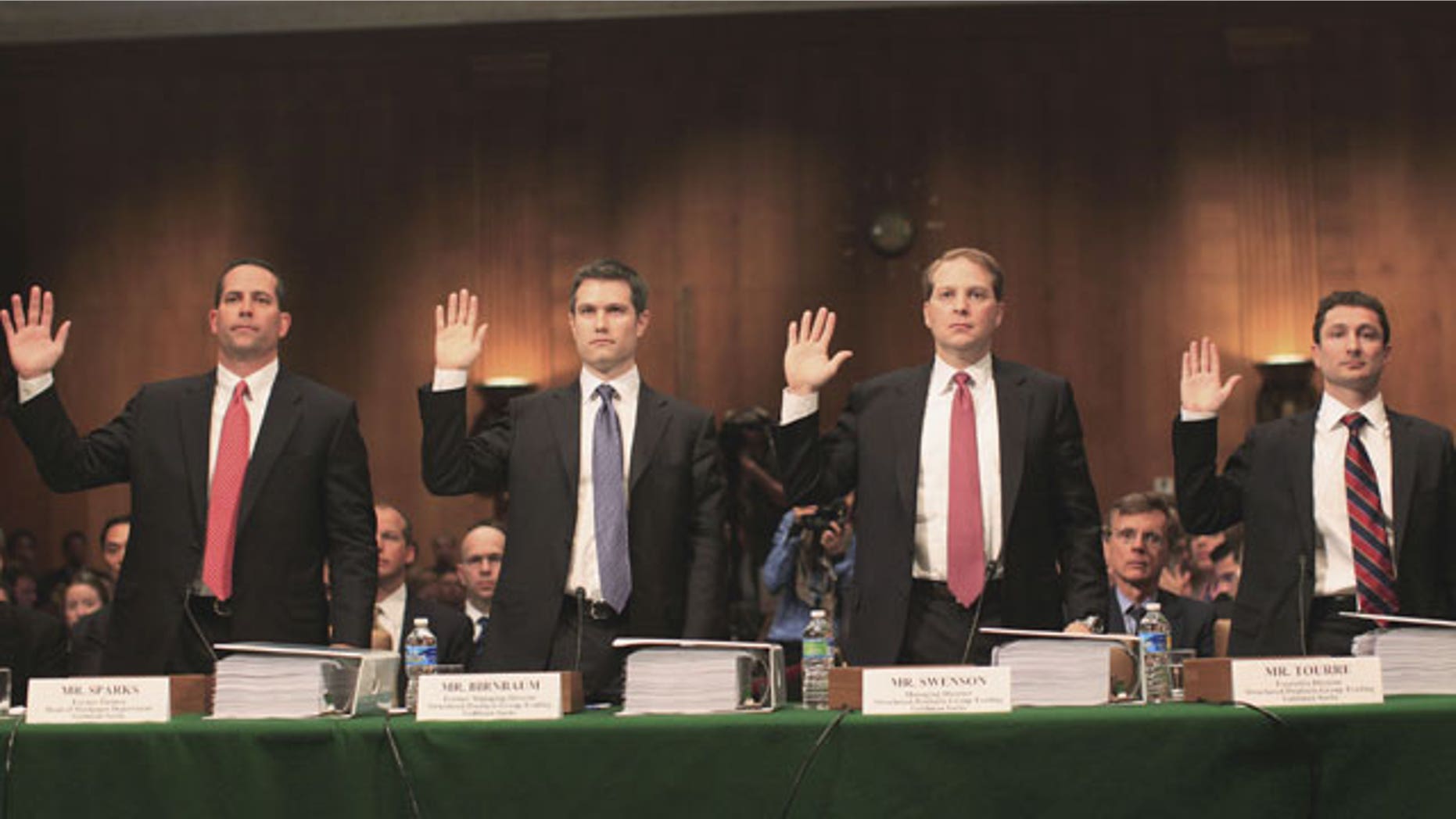 From left: Daniel Sparks, former partner, Head of Mortgages Department; Michael J. Swenson, managing director, Structured Products Group Trading; Joshua S. Birnbaum, former managing director, Structured Products Group Trading; Fabrice Tourre, Executive Director, Structured Products Group Trading; are sworn in on Capitol Hill in Washington, Tuesday, April 27, 2010, prior to testifying before the Senate Investigations subcommittee hearing on Wall Street investment banks and the financial crisis.