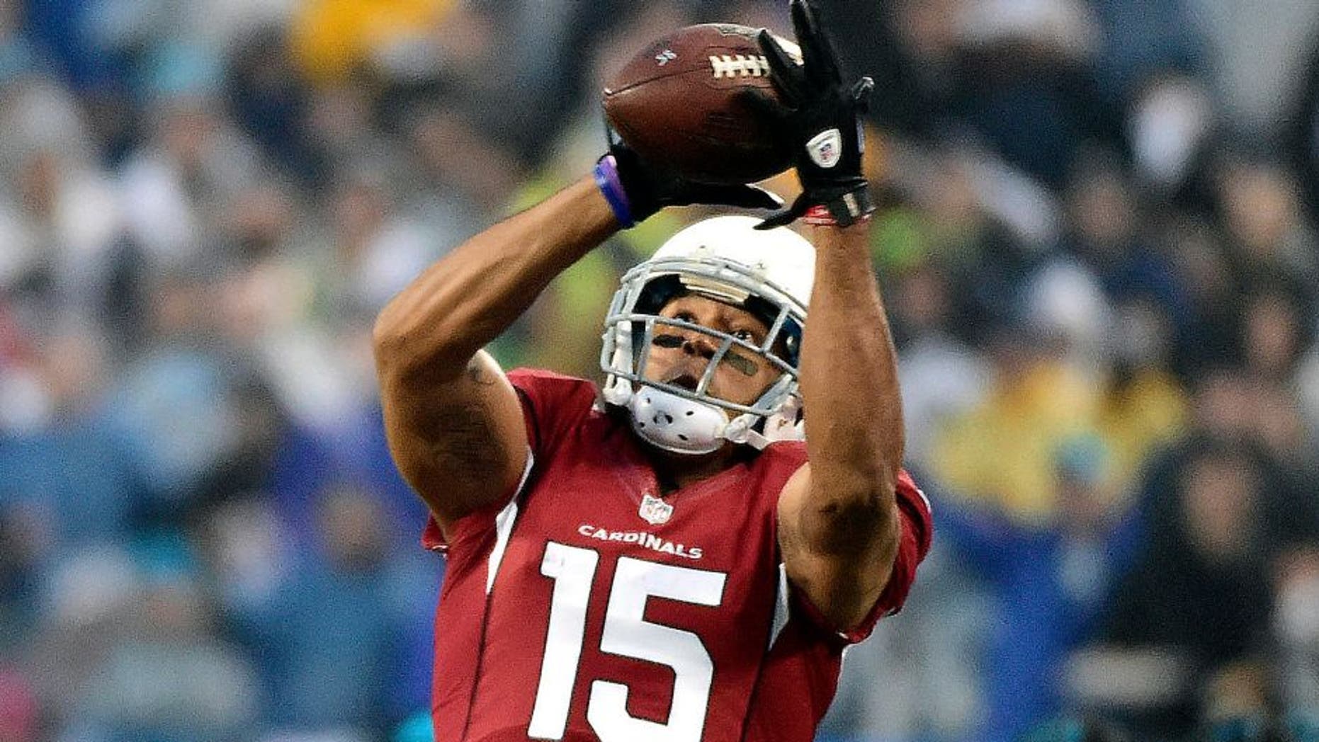 Jan 3, 2015; Charlotte, NC, USA; Arizona Cardinals wide receiver Michael Floyd (15) catches a pass over Carolina Panthers cornerback Josh Norman (24) during the first quarter in the 2014 NFC Wild Card playoff football game at Bank of America Stadium. Mandatory Credit: Bob Donnan-USA TODAY Sports