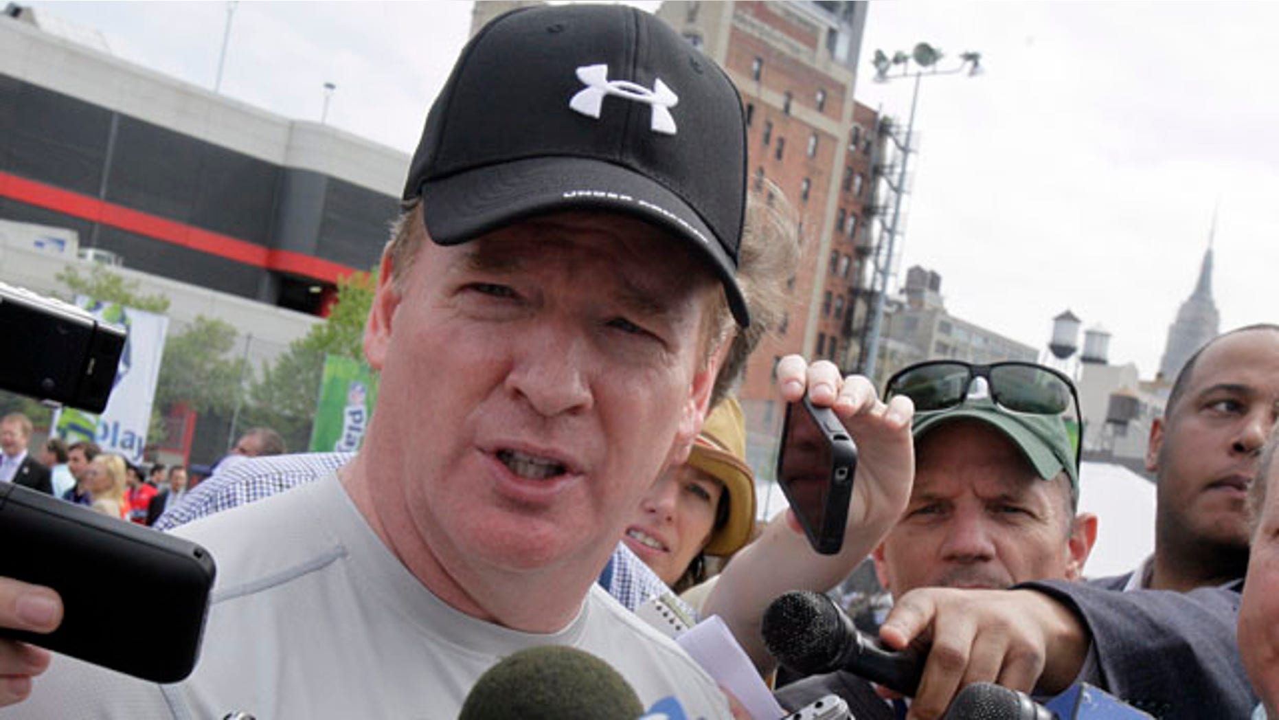 April 27: National Football League commissioner Roger Goodell is surrounded by media at an NFL predraft event in New York.