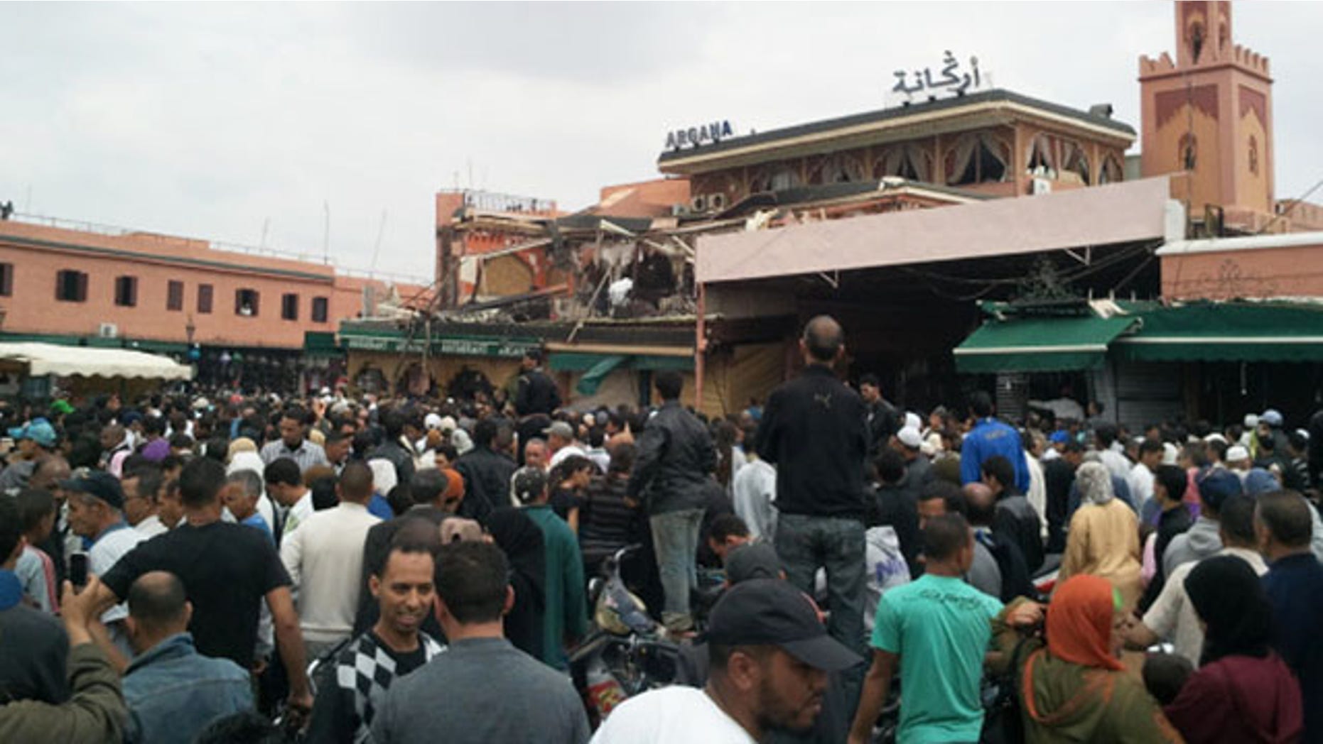 April 28: A crowd congregates outside a cafe in Marrakech. Morocco.