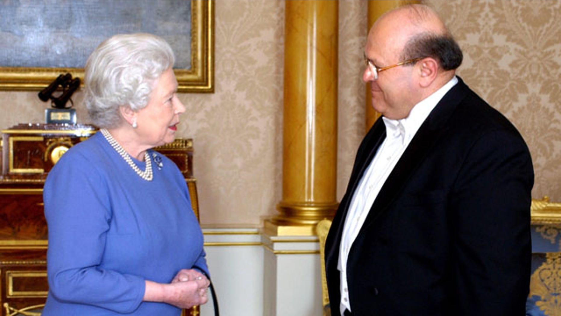 In this March 3, 2005, file photo, Queen Elizabeth II receives the Ambassador of Syria, Sami Khiyami, at Buckingham Palace, London.