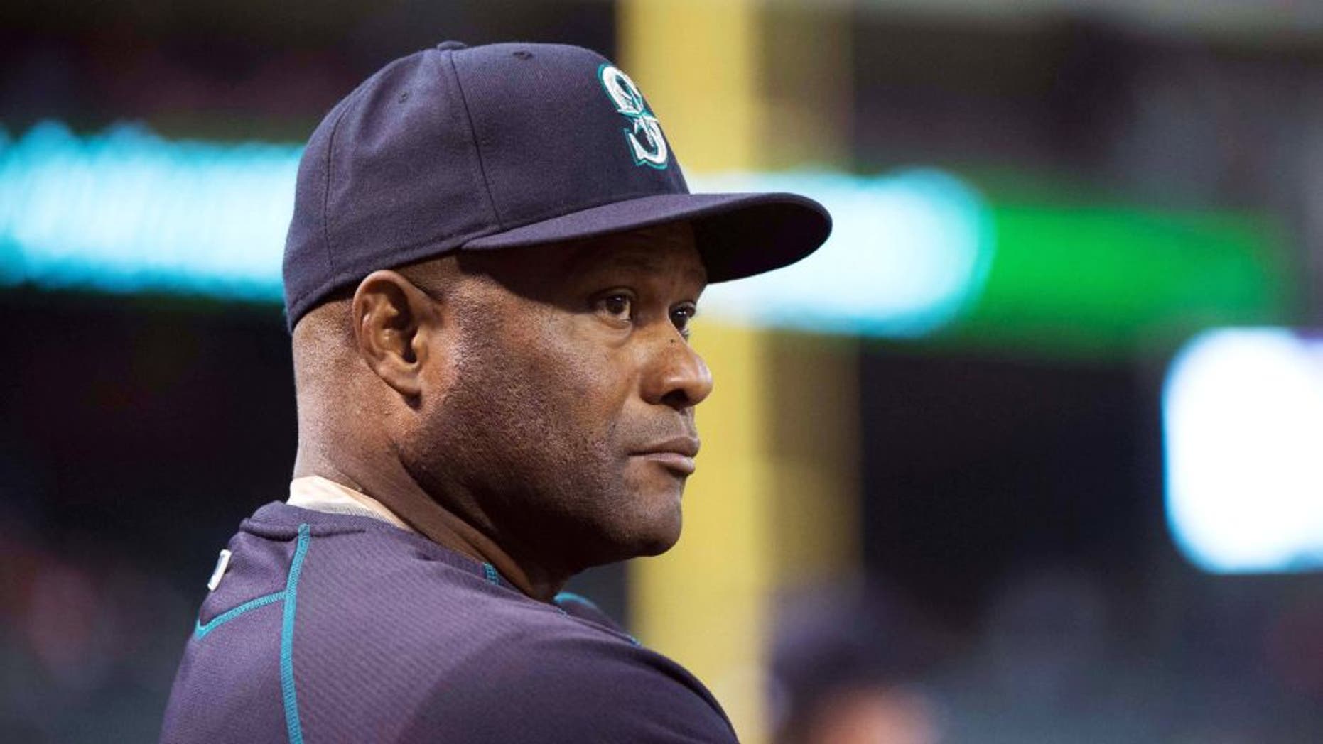 Apr 27, 2015; Arlington, TX, USA; Seattle Mariners manager Lloyd McClendon (21) watches his team take on the Texas Rangers at Globe Life Park in Arlington. Mandatory Credit: Jerome Miron-USA TODAY Sports
