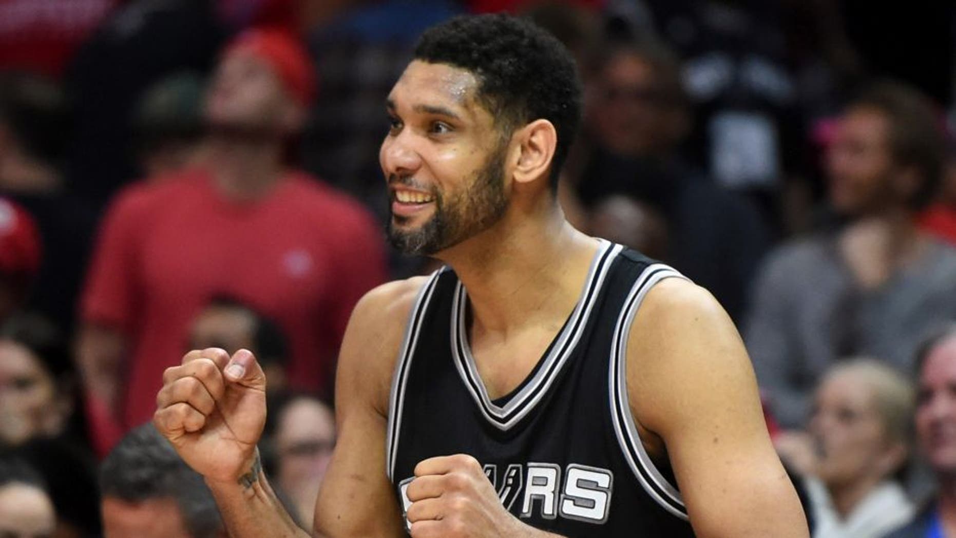 Apr 28, 2015; Los Angeles, CA, USA; San Antonio Spurs forward Tim Duncan (21) reacts in the final seconds against the Los Angeles Clippers in game five of the first round of the NBA Playoffs at Staples Center. The Spurs defeated the Clippers 111-107 to take a 3-2 lead. Mandatory Credit: Kirby Lee-USA TODAY Sports