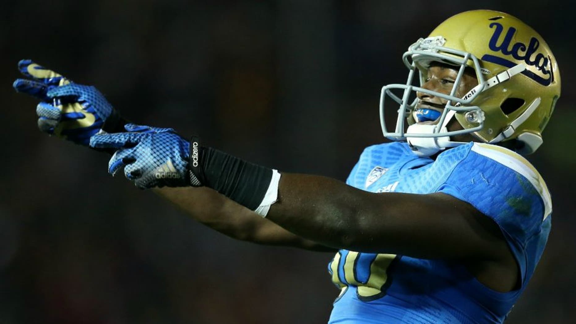 the USC Trojans the UCLA Bruins at the Rose Bowl on November 22, 2014 in Pasadena, California. (Photo by Stephen Dunn/Getty Images),PASADENA, CA - NOVEMBER 22: Linebacker Myles Jack #30 of the UCLA Bruins celebrates after the Bruins stopped the USC Trojans on fourth down on the five yard line to take over on downs on the final play of the first quarter at the Rose Bowl on November 22, 2014 in Pasadena, California. (Photo by Stephen Dunn/Getty Images)