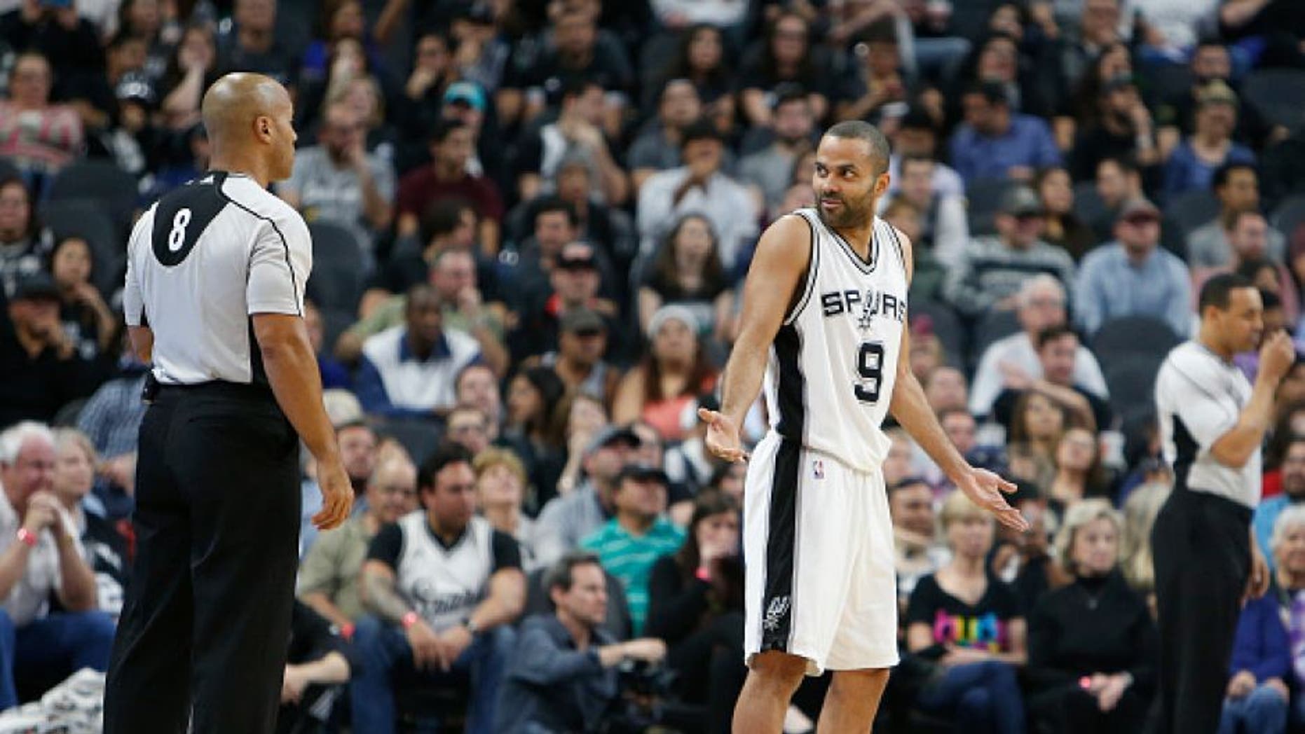 SAN ANTONIO,TX - FEBRUARY 1: Tony Parker #9 of the San Antonio Spurs gestures official Marc Davis in game against Orlando Magic at AT&T Center on February 1, 2016 in San Antonio, Texas. NOTE TO USER: User expressly acknowledges and agrees that , by downloading and or using this photograph, User is consenting to the terms and conditions of the Getty Images License Agreement. (Photo by Ronald Cortes/Getty Images)