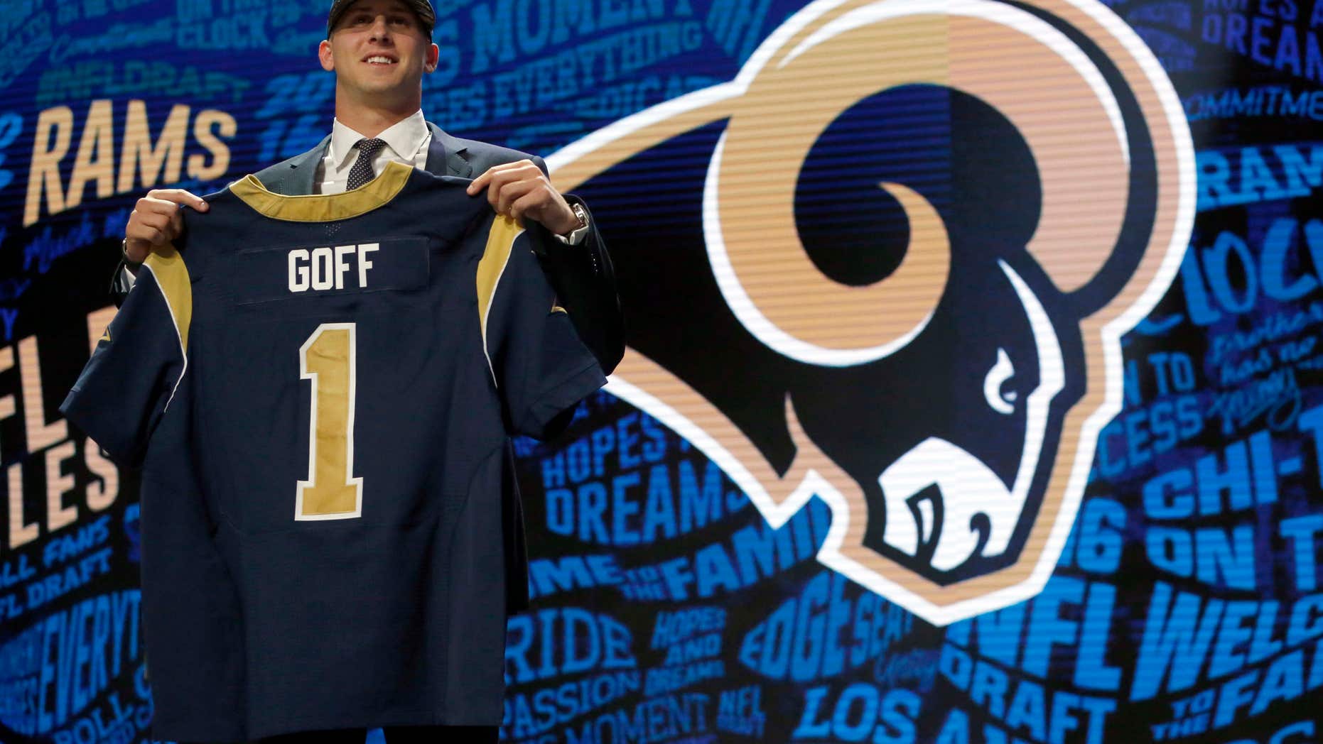 California’s Jared Goff poses for photos after being selected by the Los Angeles Rams as the first pick in the first round of the 2016 NFL football draft, Thursday, April 28, 2016, in Chicago.