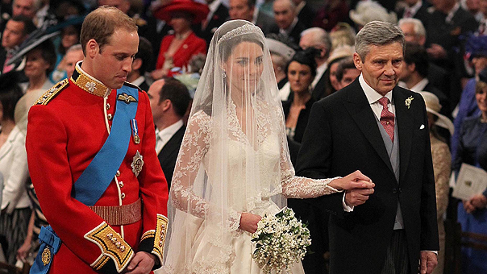 April 29: Britain's Prince William and Kate Middleton, centre, stand at the altar during the service along with Kate's father Michael Middleton.