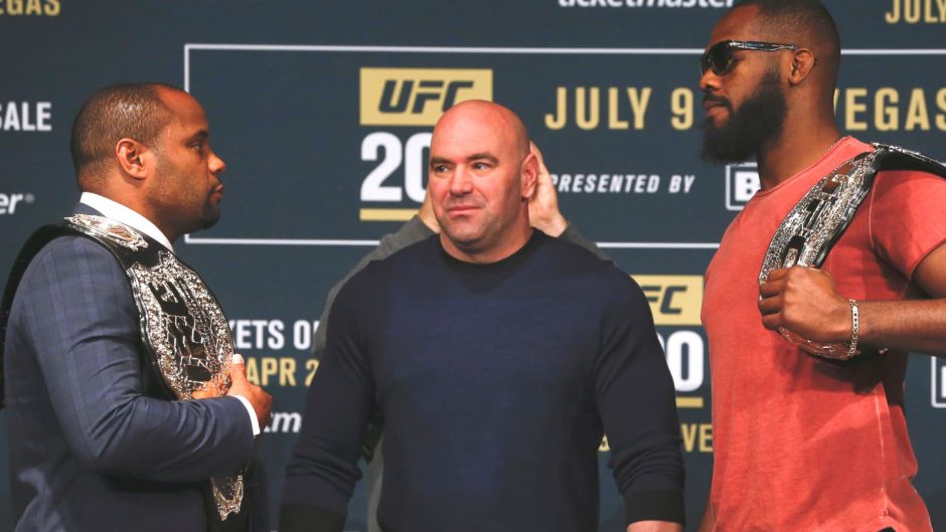 NEW YORK, NY - APRIL 27: UFC president Dana White stars between Daniel Cormier (L) and Jon Jones as they square off during a media availability for UFC 200 at Madison Square Garden on April 27, 2016 in New York City. (Photo by Jeff Zelevansky/Getty Images)