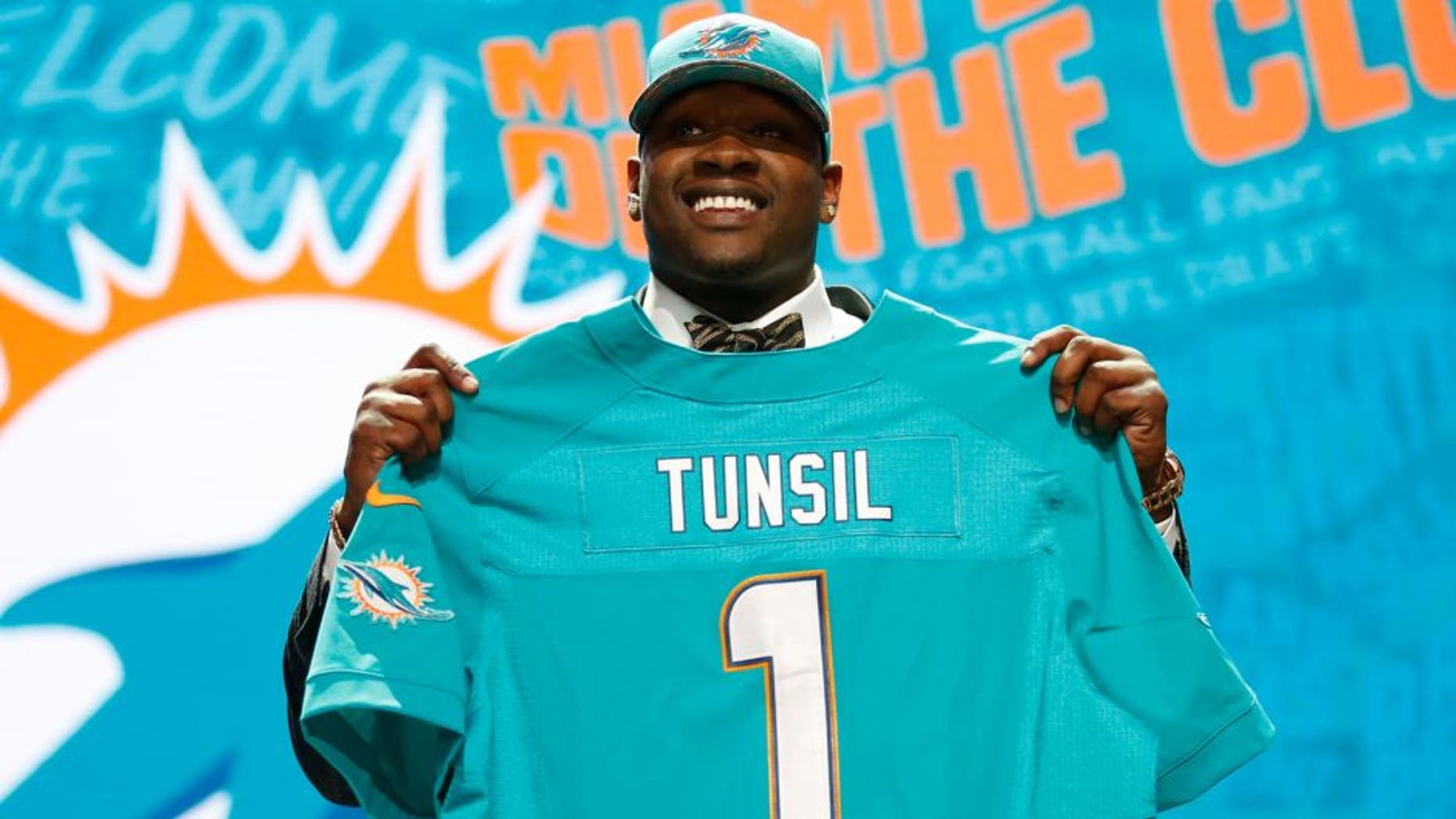 Apr 28, 2016; Chicago, IL, USA; Laremy Tunsil (Mississippi) is selected by the Miami Dolphins as the number thirteen overall pick in the first round of the 2016 NFL Draft at Auditorium Theatre. Mandatory Credit: Kamil Krzaczynski-USA TODAY Sports