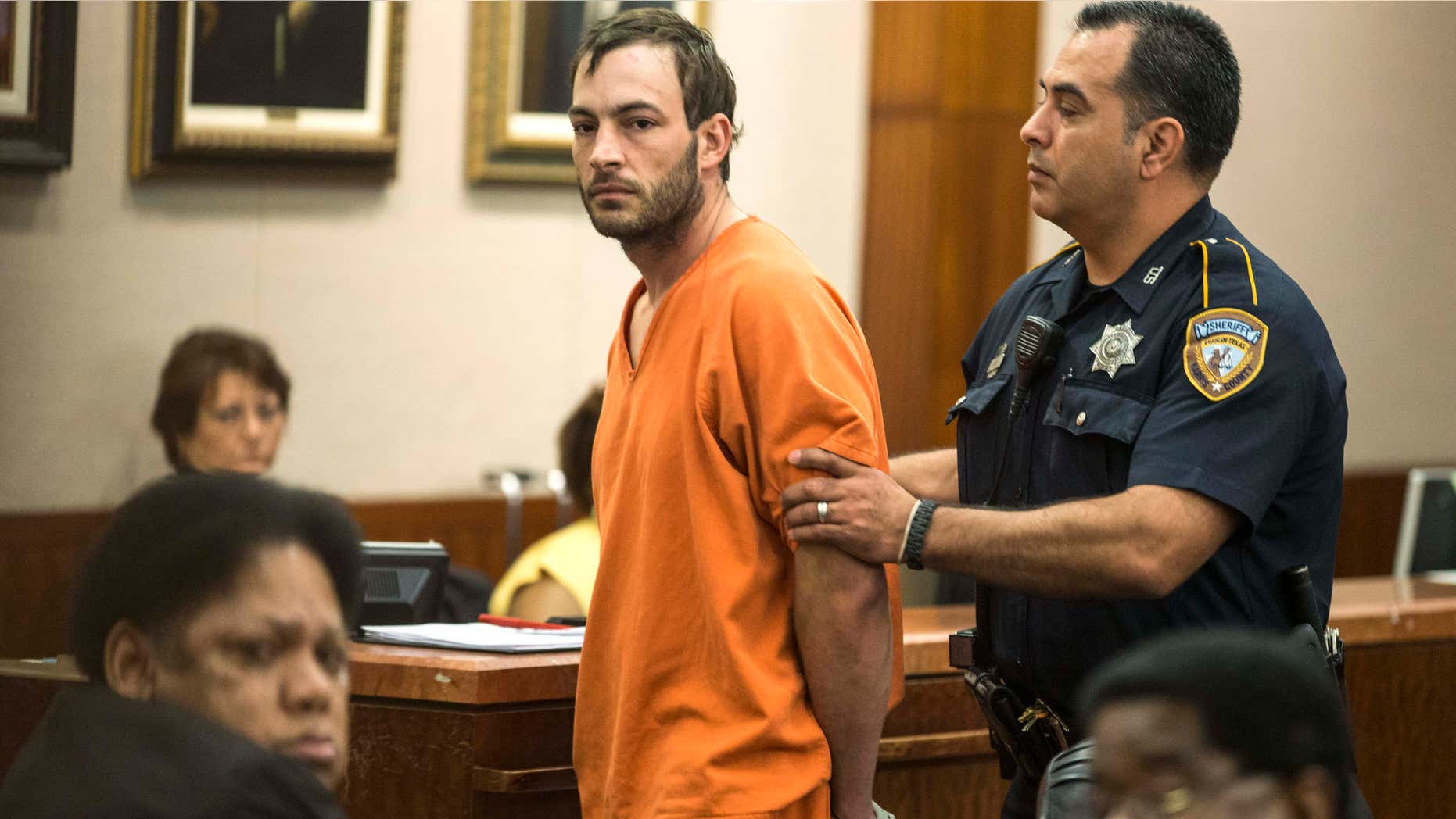 April 29, 2015: Blaine Boudreaux is escorted from the courtroom.