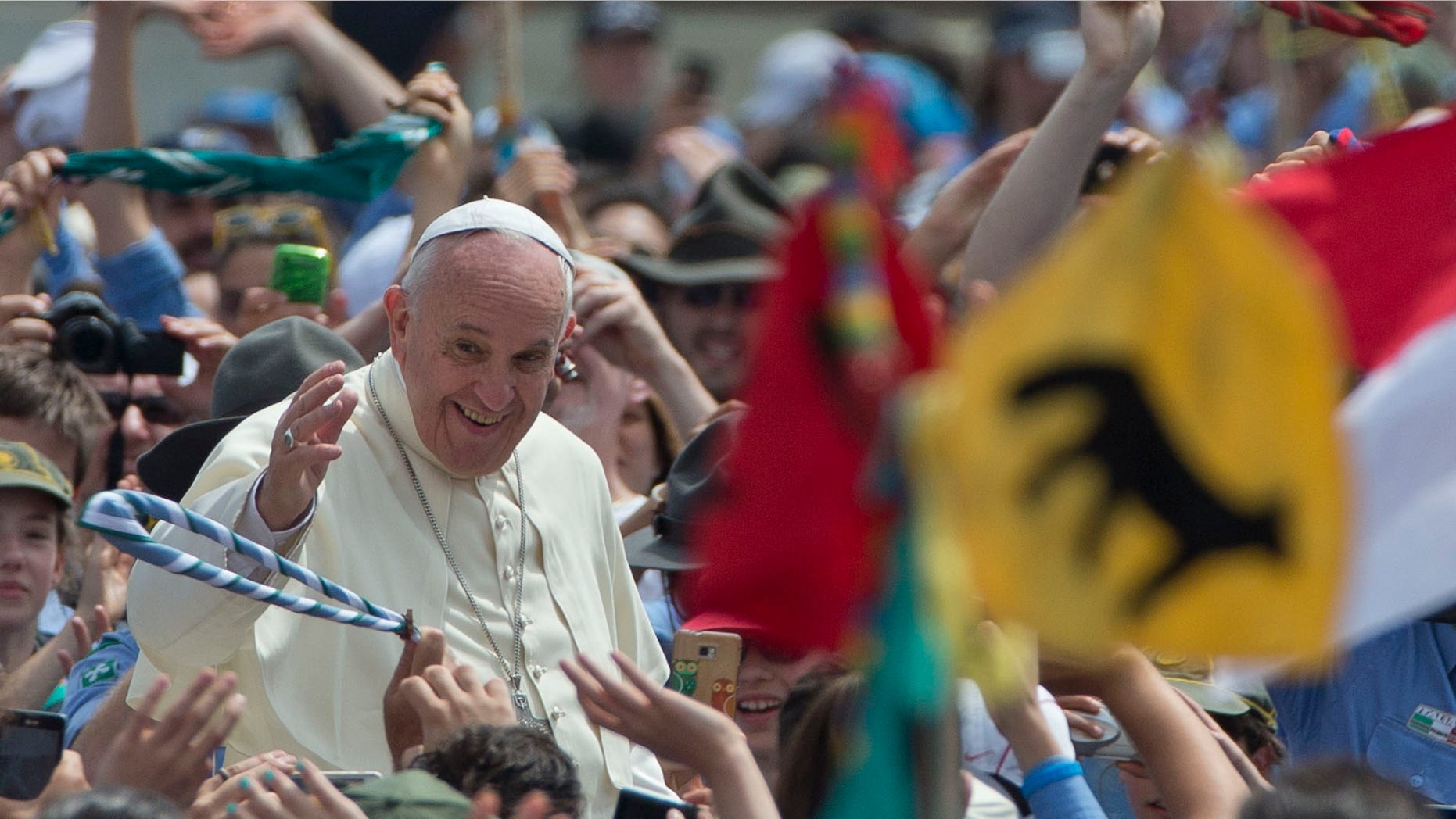 Pope Francis is cheered by the crowd as he arrives for an audience with Italian AGESCI boy scouts association's members in St. Peter's Square at the Vatican, Saturday, June 13, 2015. (AP Photo/Alessandra Tarantino)