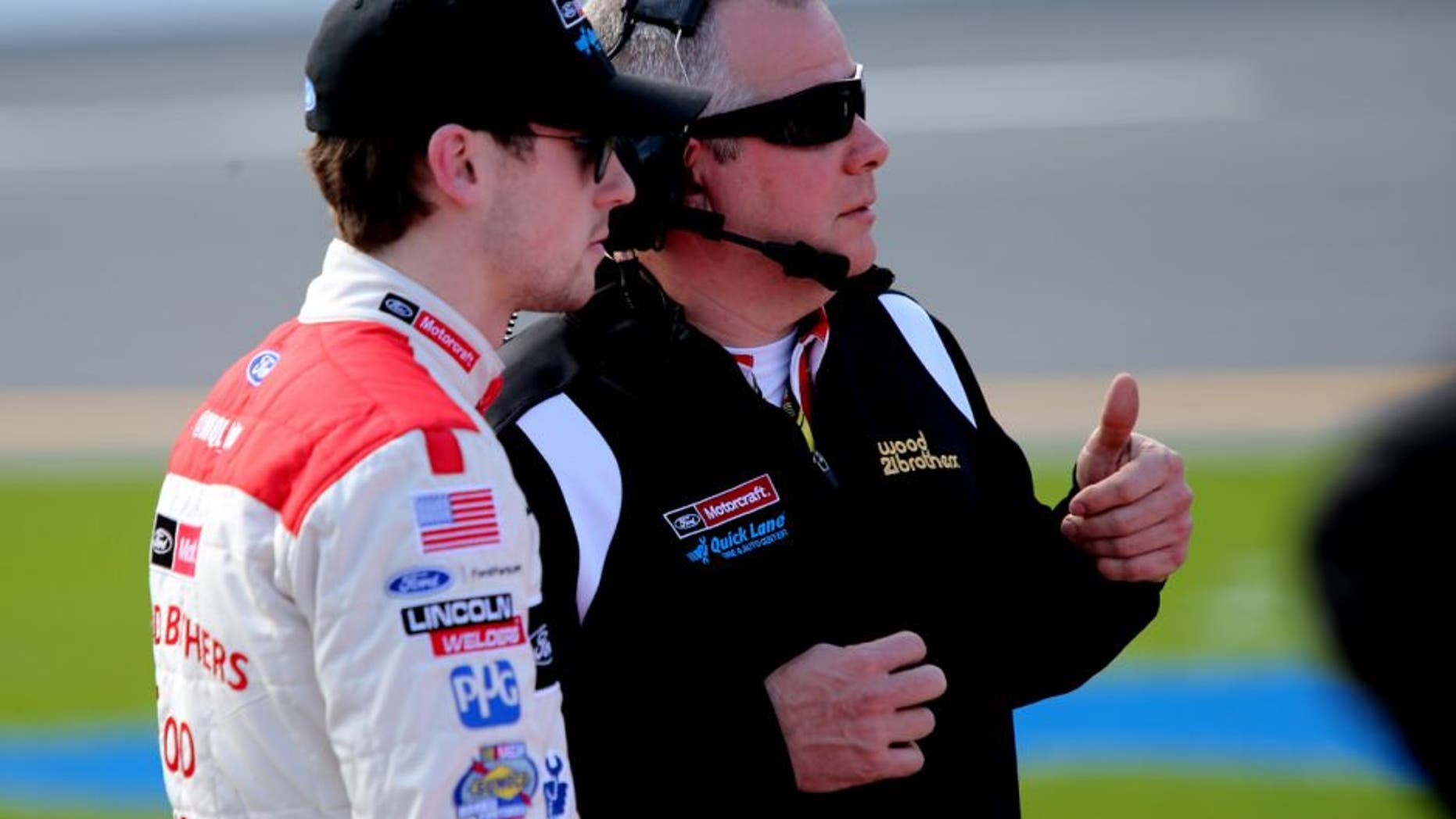 DAYTONA BEACH, FL - FEBRUARY 14: Ryan Blaney, driver of the #21 Motorcraft/Quick Lane Tire & Auto Center Ford, talks with crew chief Jeremy Bullins on the grid during qualifying for the NASCAR Sprint Cup Series Daytona 500 at Daytona International Speedway on February 14, 2016 in Daytona Beach, Florida. (Photo by Jerry Markland/Getty Images)
