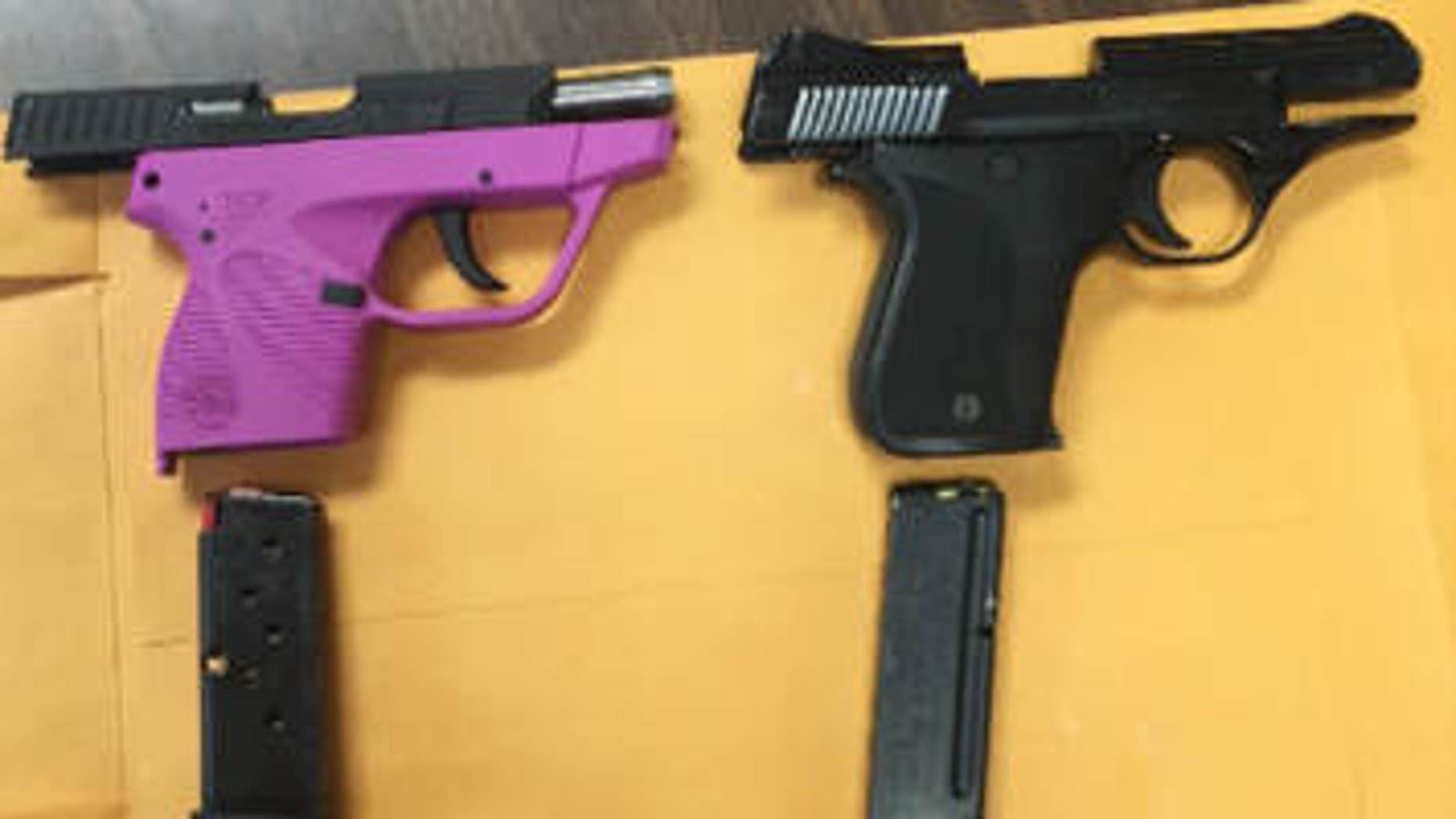 April 30, 2015: In this photo provided by Kentucky State Police, handguns sit on a table.