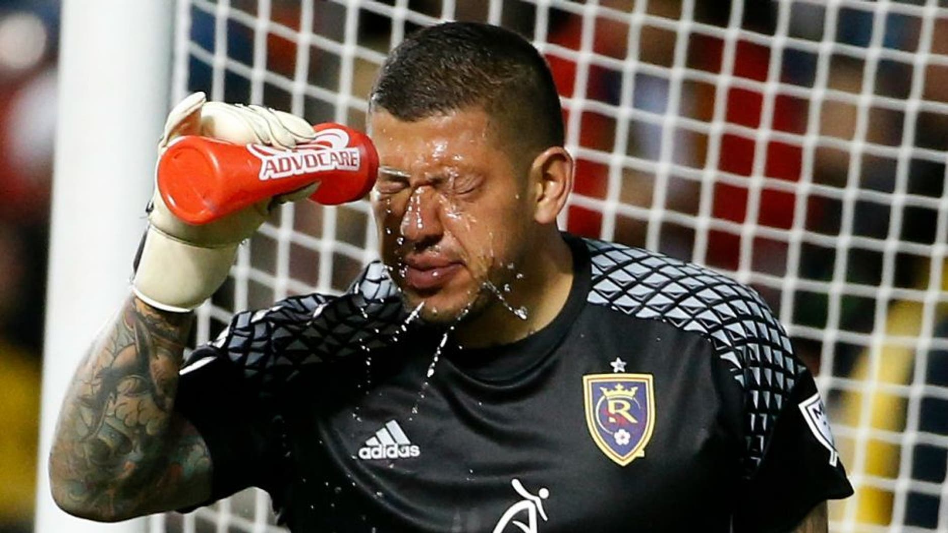 Apr 30, 2016; Sandy, UT, USA; Real Salt Lake goalkeeper Nick Rimando (18) cools down after taking a ball to the face in the second half against the Houston Dynamo at Rio Tinto Stadium. Real Salt Lake defeated Houston Dynamo 2-1. Mandatory Credit: Jeff Swinger-USA TODAY Sports