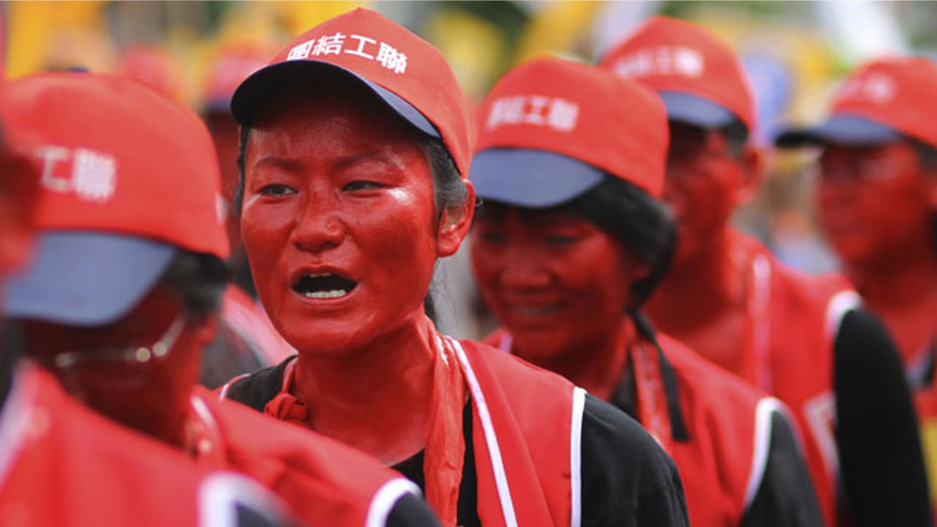 Labor rights activists rally to mark May Day with a demonstration to protest the rise in unemployment and falling wages in Taipei, Taiwan, Saturday, May 1, 2010.
