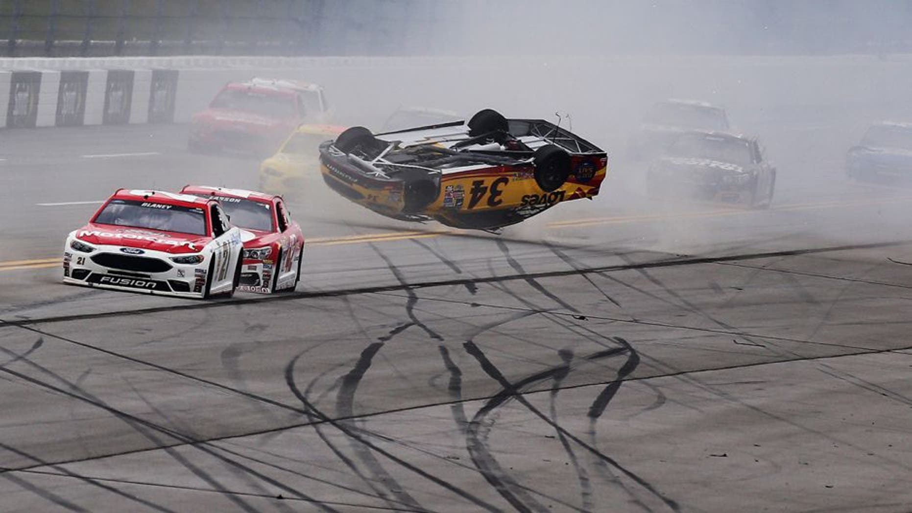 TALLADEGA, AL - MAY 01: Chris Buescher, driver of the #34 Love's Travel Stops/CSX-Play it Safe Ford, has an on track incident during the NASCAR Sprint Cup Series GEICO 500 at Talladega Superspeedway on May 1, 2016 in Talladega, Alabama. (Photo by Jerry Markland/Getty Images)