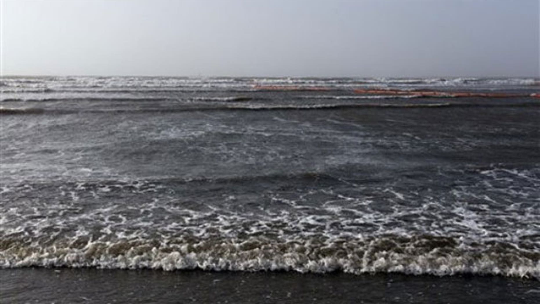 May 2: Water from the Gulf of Mexico washes ashore on an island near the South Pass of the Mississippi River near Venice, La. (AP).