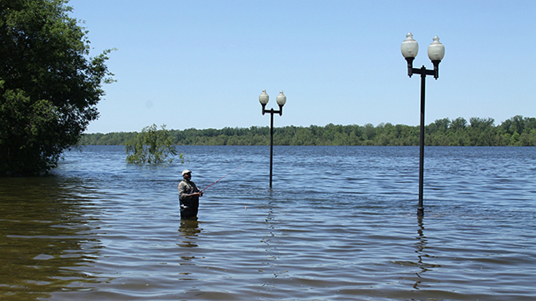 May 2: Angler Jessie Wilson waded off the levee into what was the parking area on the Greenville, Miss. waterfront to fish.
